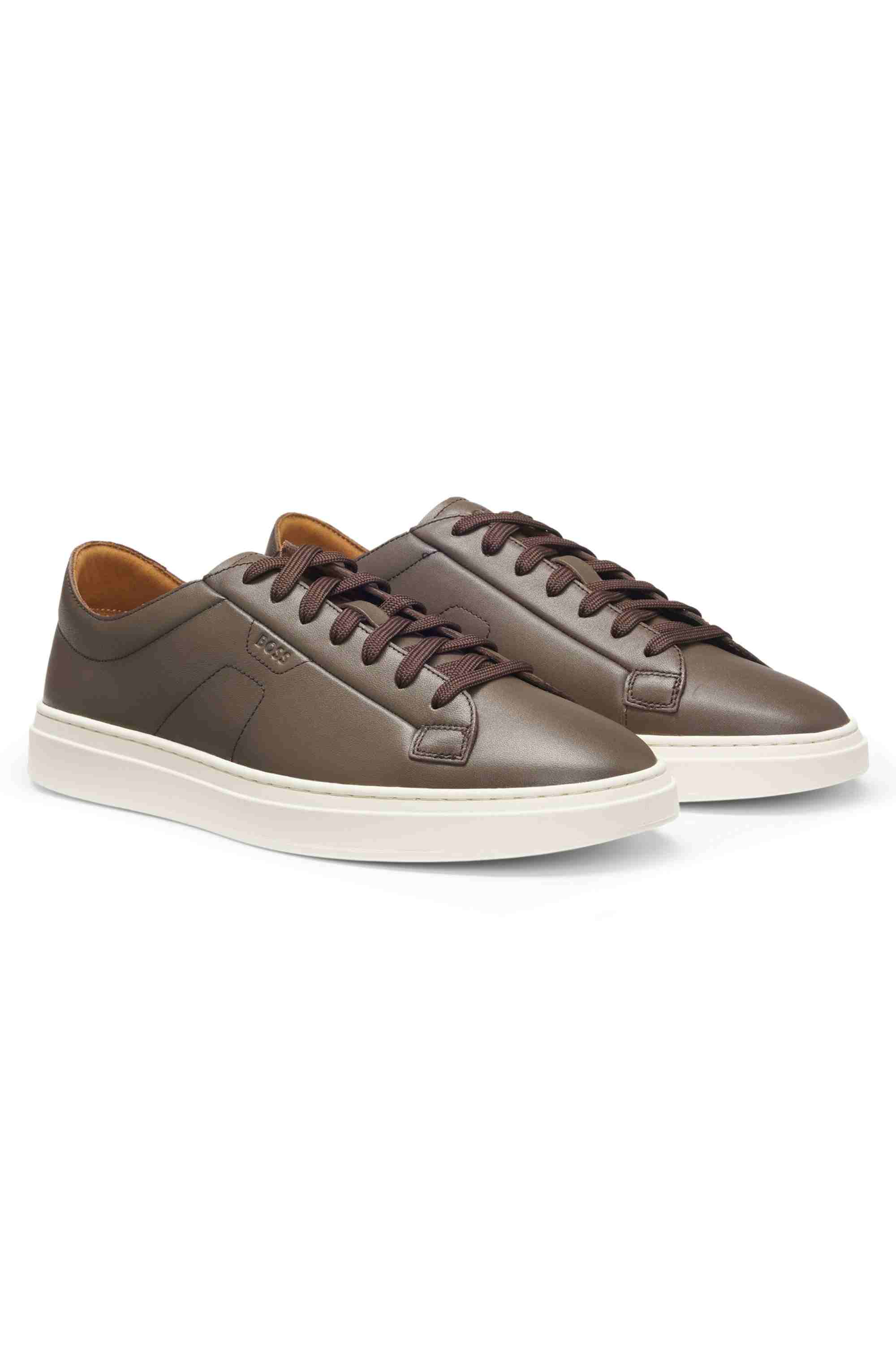 Low-top trainers in leather with embossed logo
