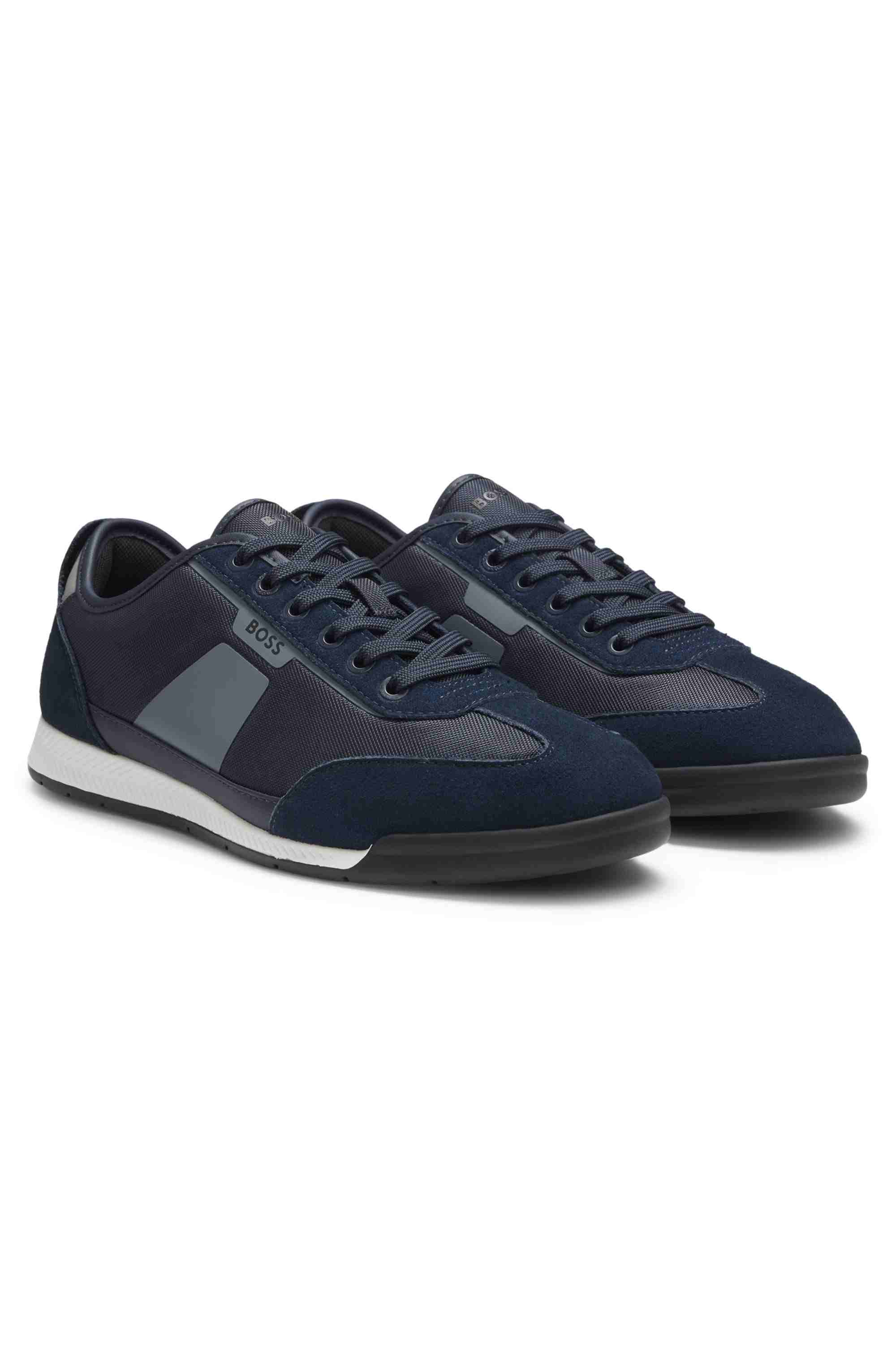Low-top trainers with structured trims