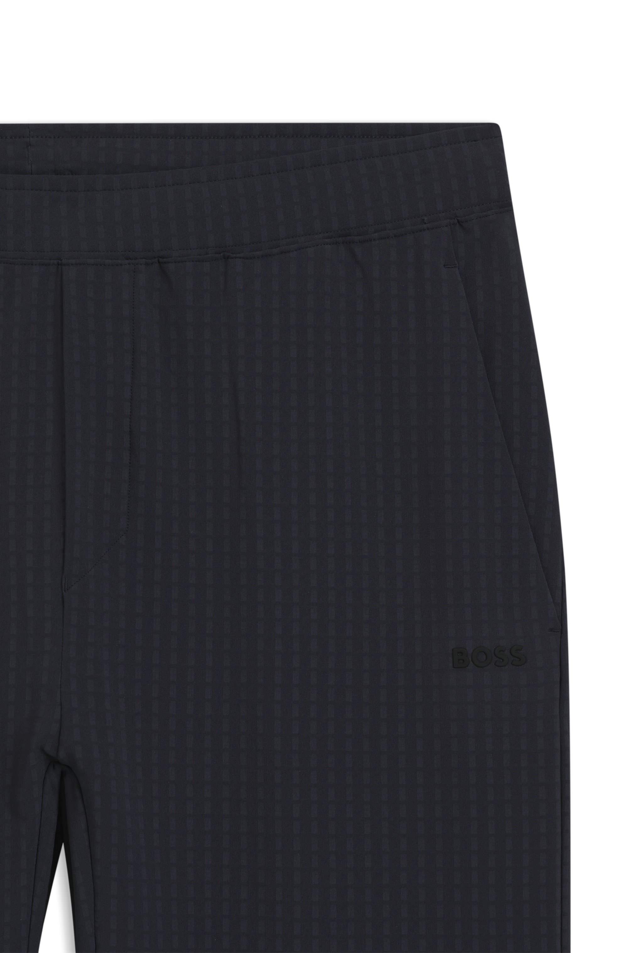 Drawstring trousers in stretch waffle fabric with framed zip