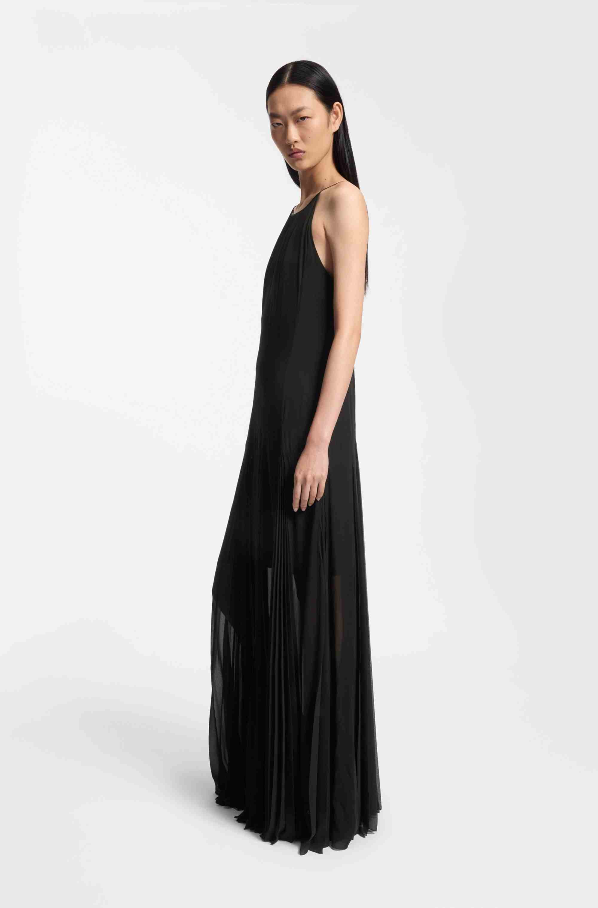 Sleeveless dress with plissé skirt inserts