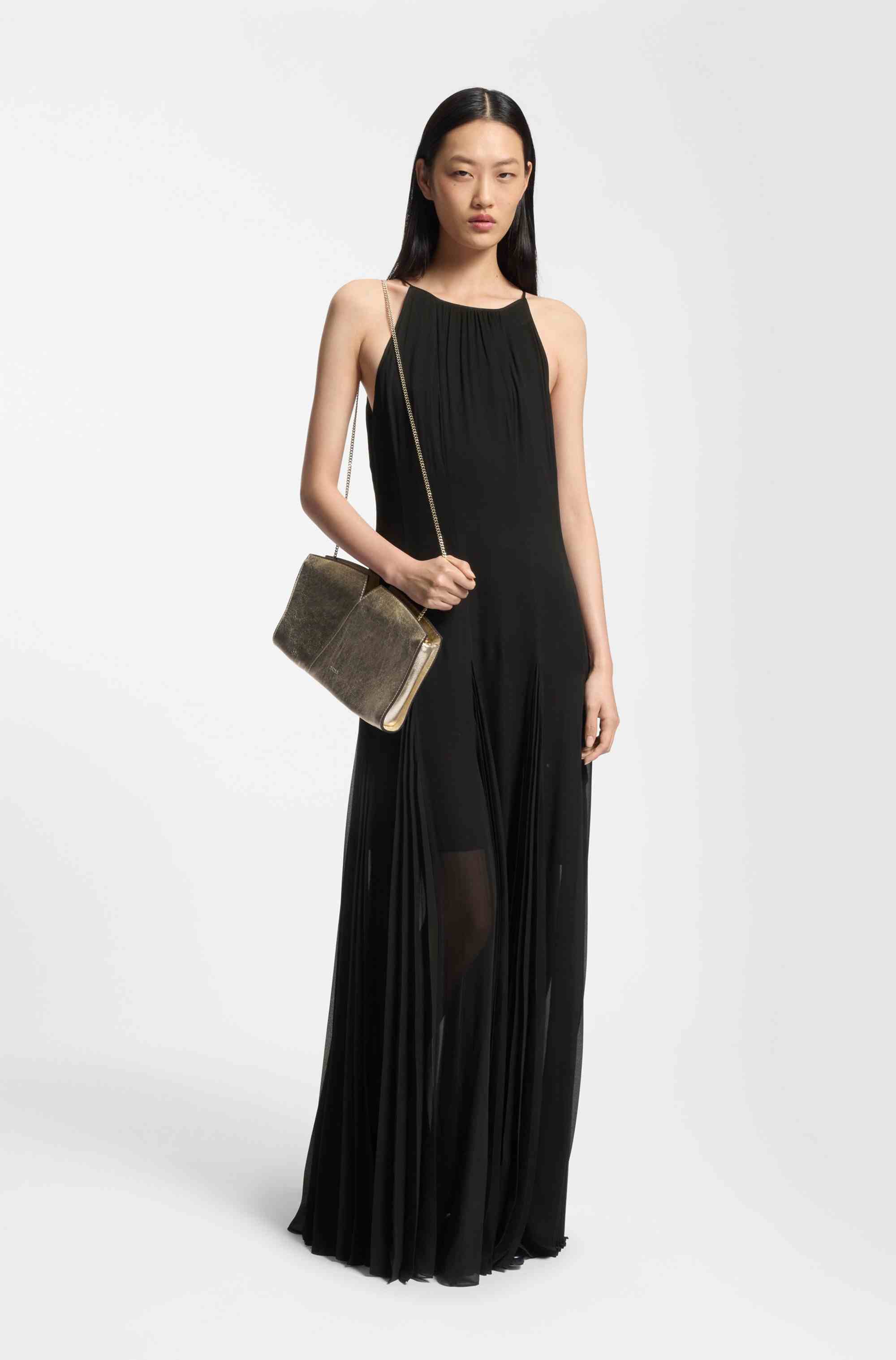 Sleeveless dress with plissé skirt inserts