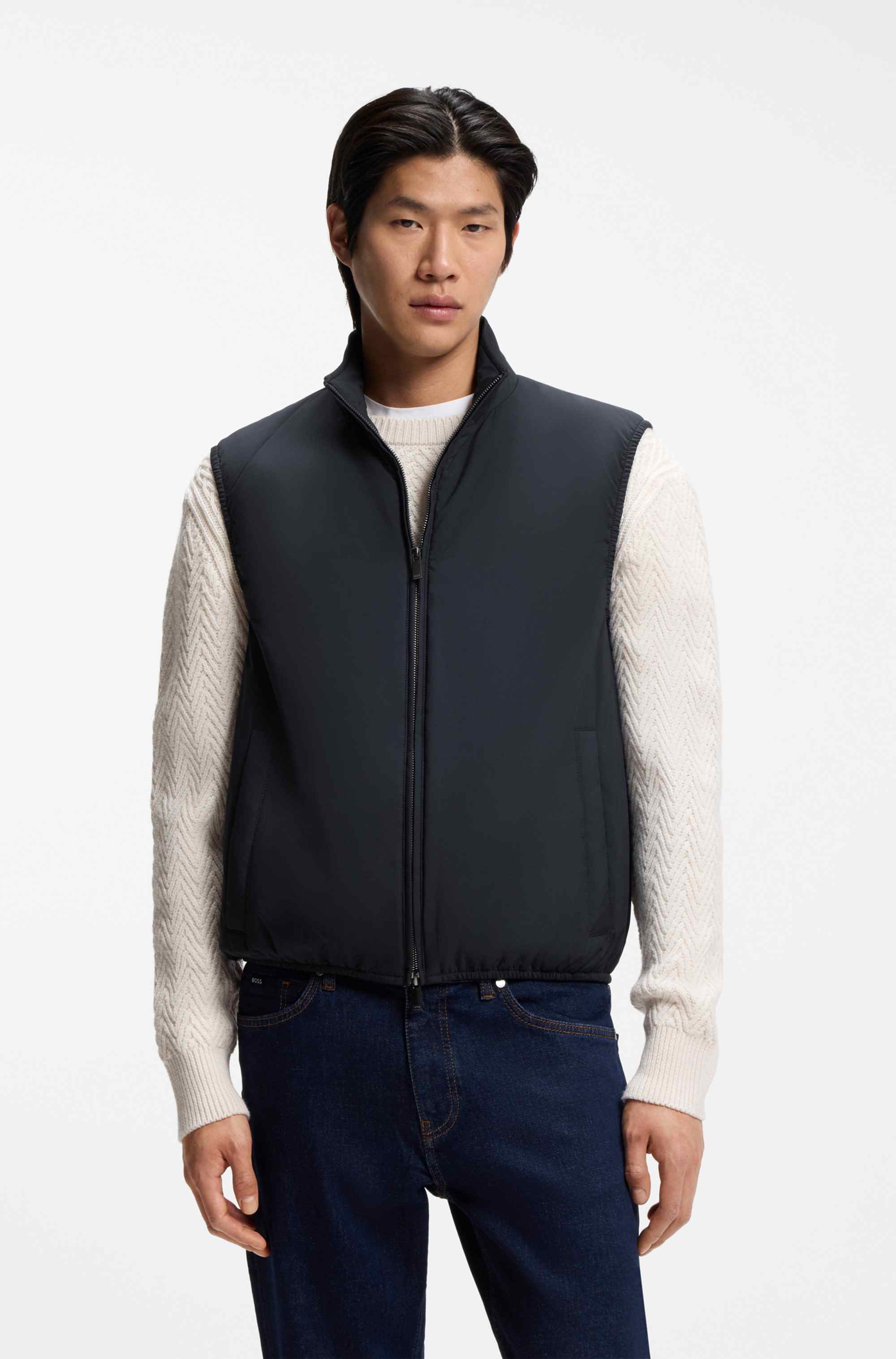 Water-repellent gilet with knitted trims