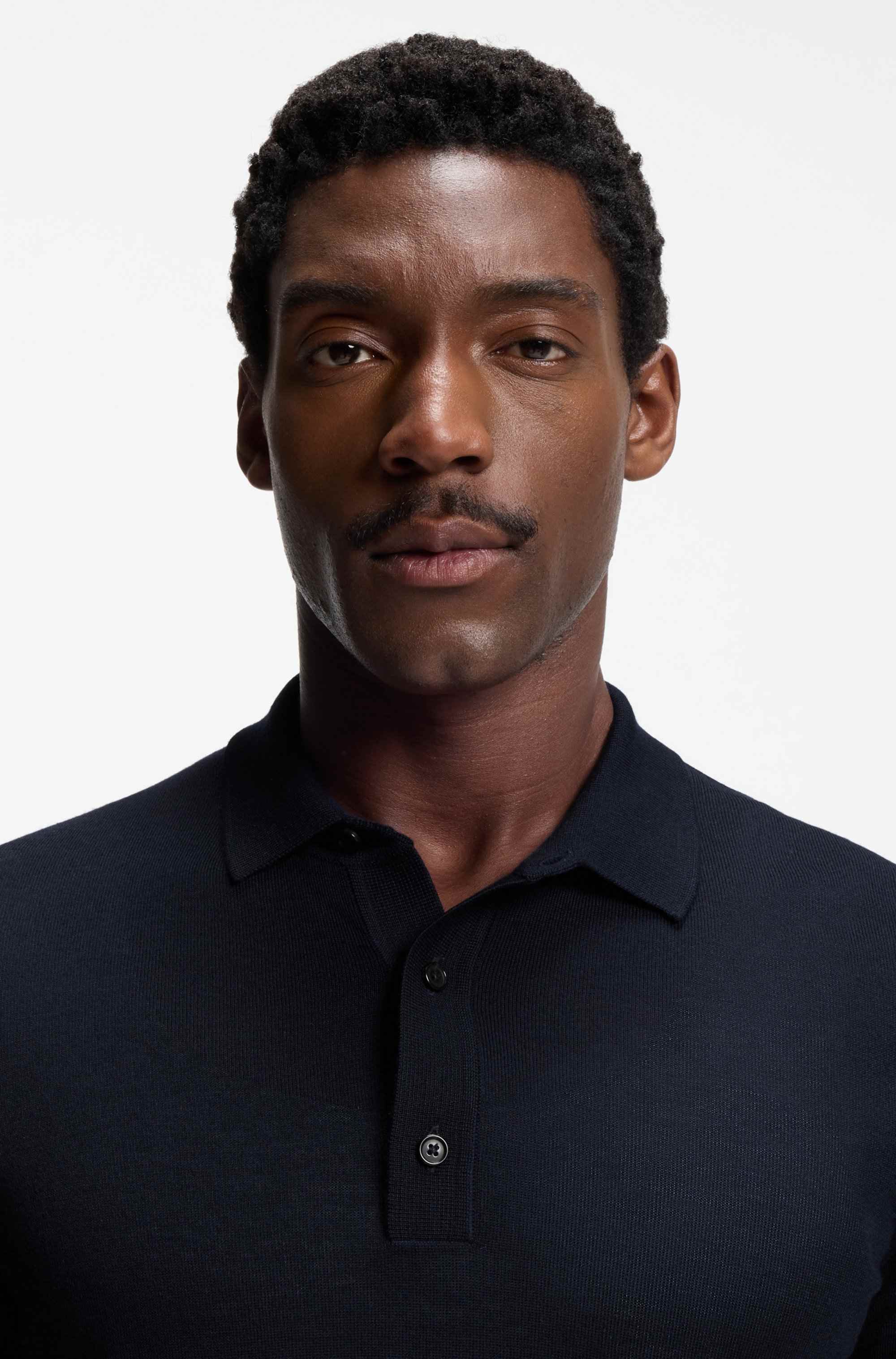 Short-sleeved sweater in virgin wool with polo collar