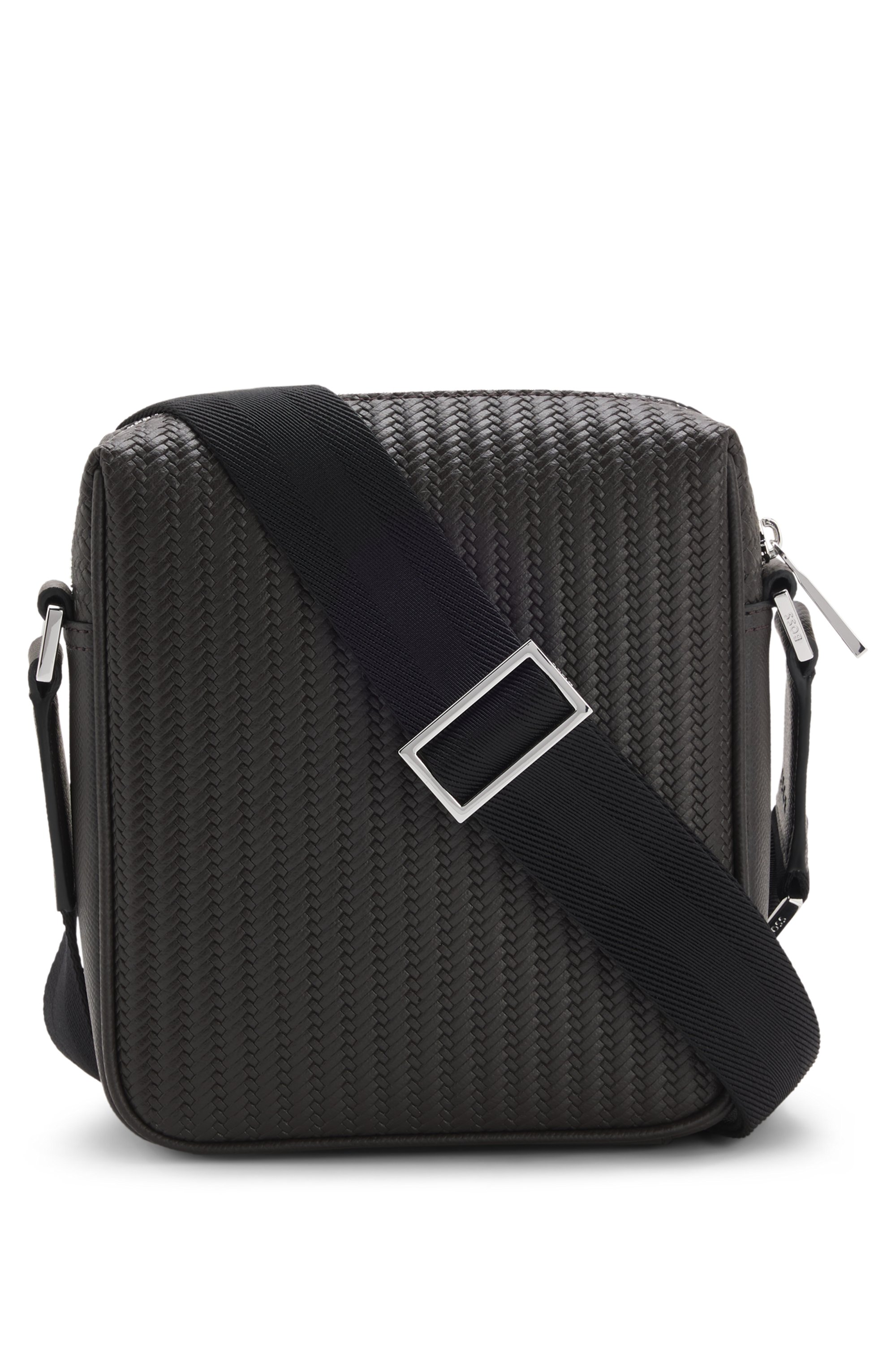 Reporter bag with embossed pattern