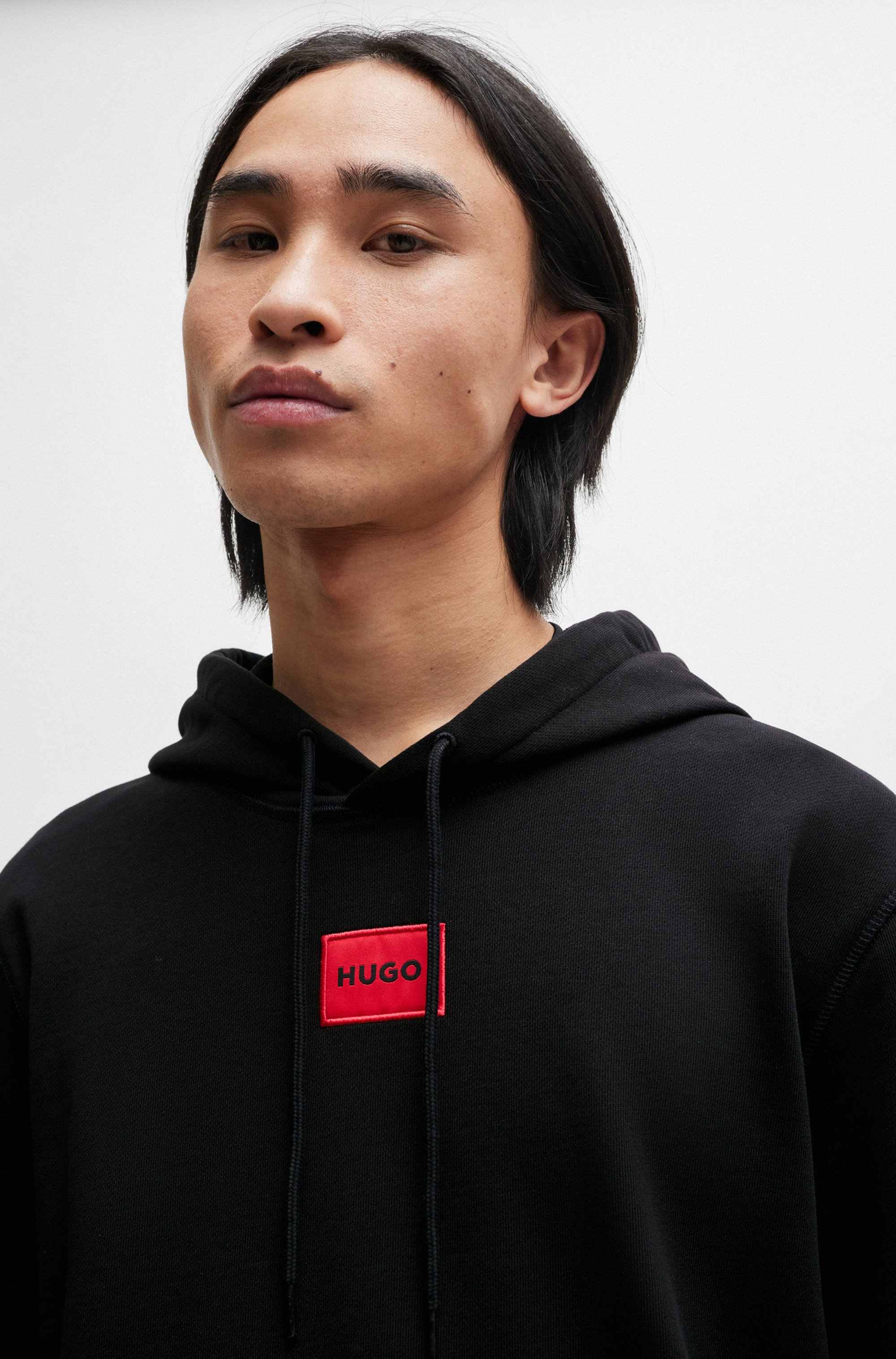 Cotton-terry hoodie with red logo label
