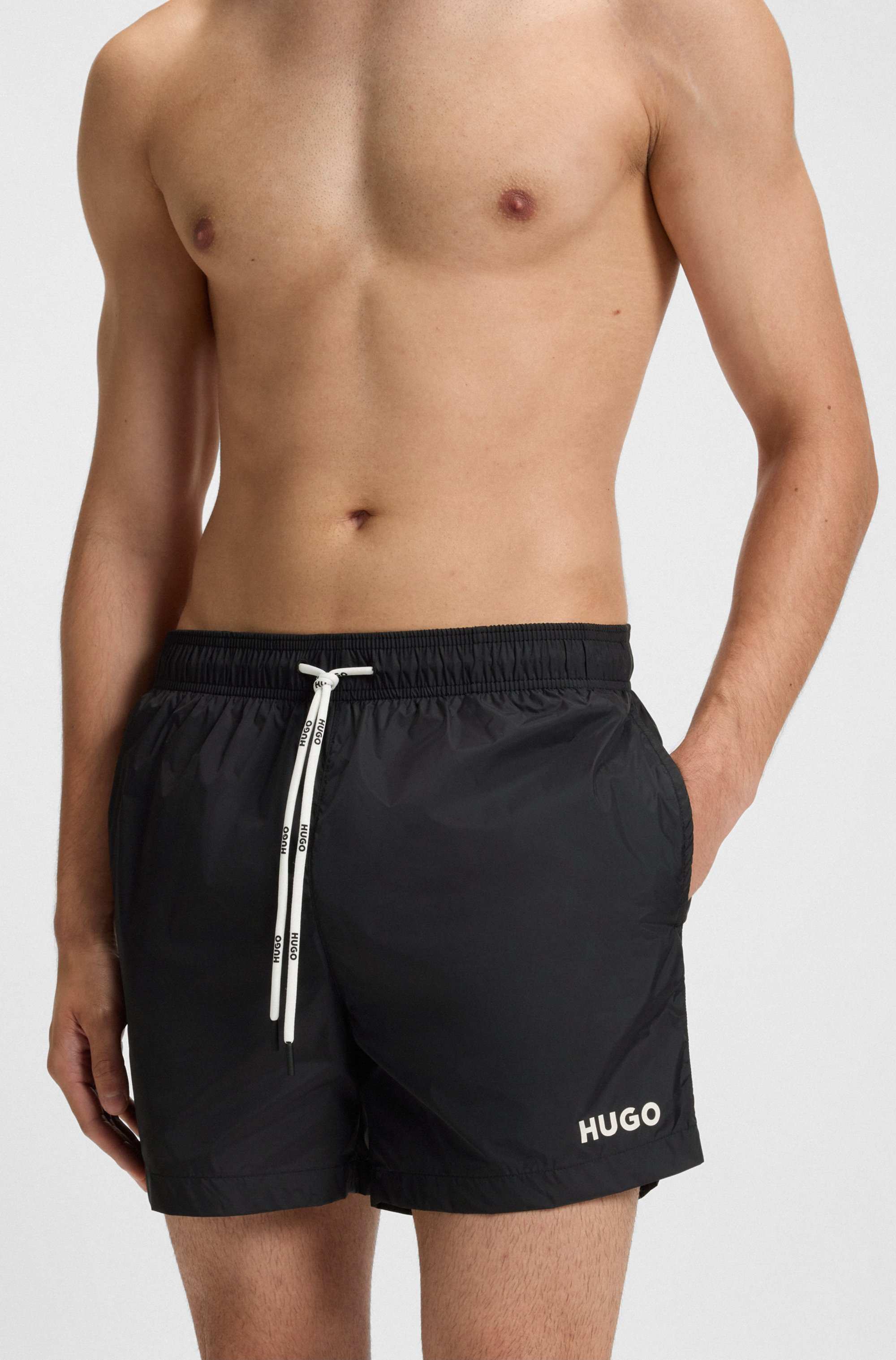 Fully lined swim shorts with contrast logo
