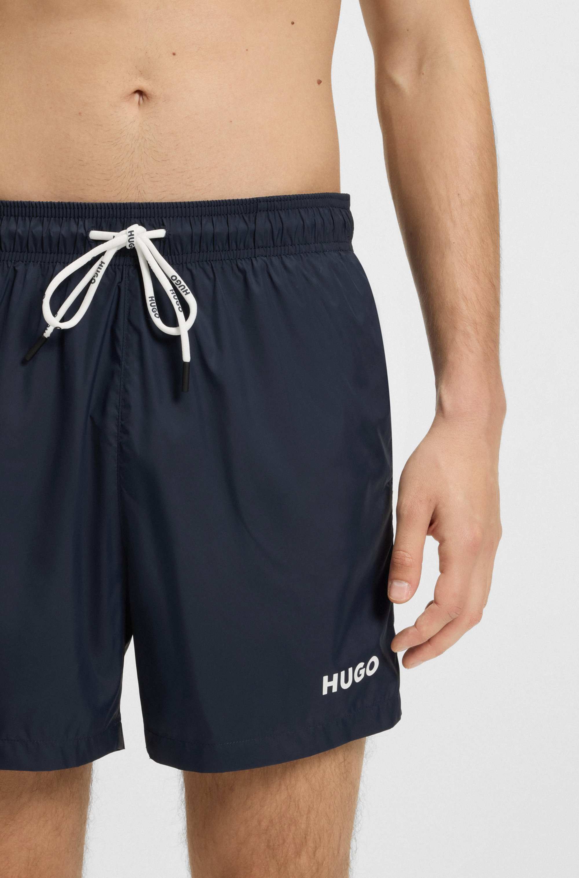 Fully lined swim shorts with contrast logo