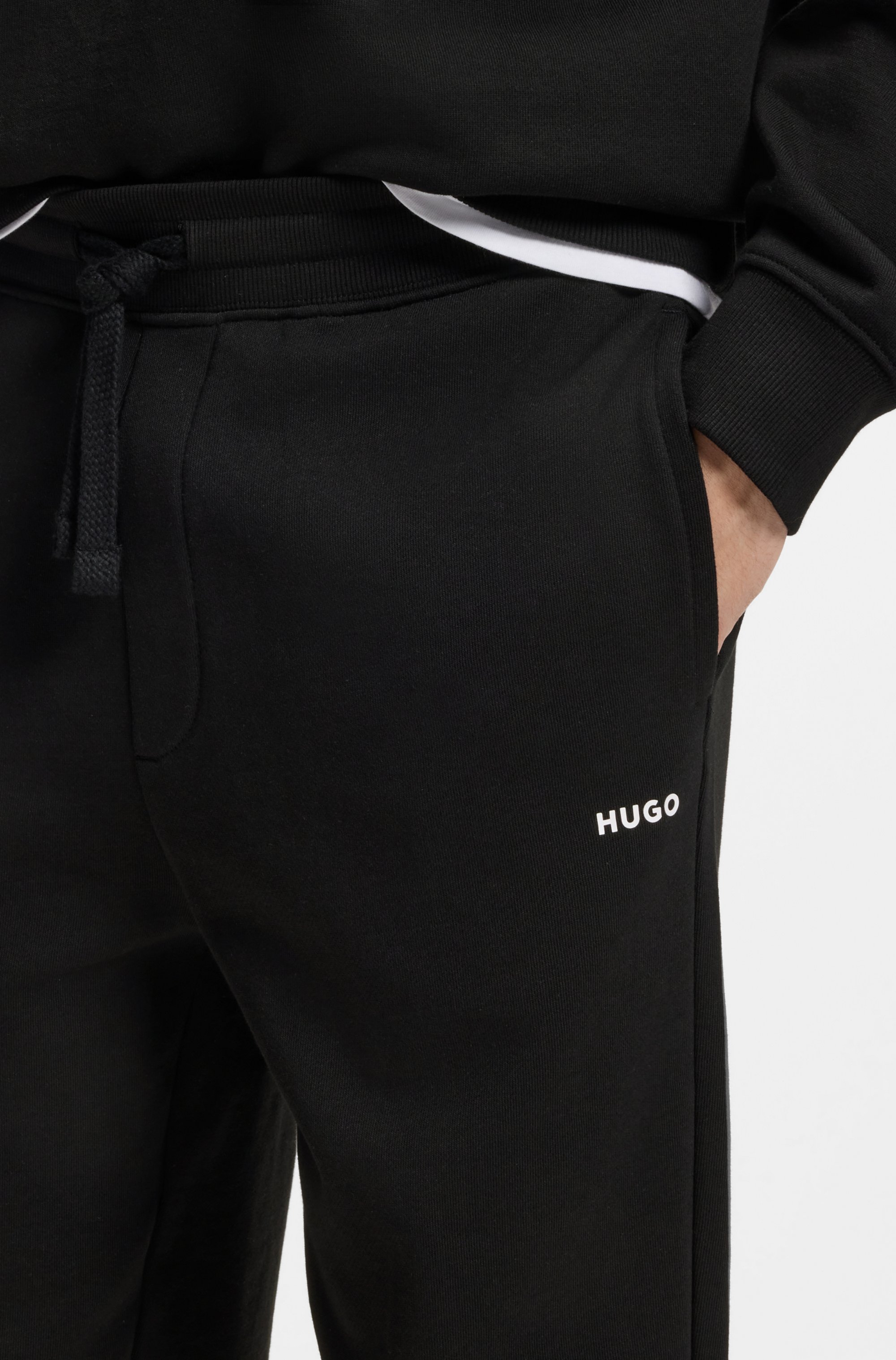 Cuffed tracksuit bottoms in cotton terry with logo print