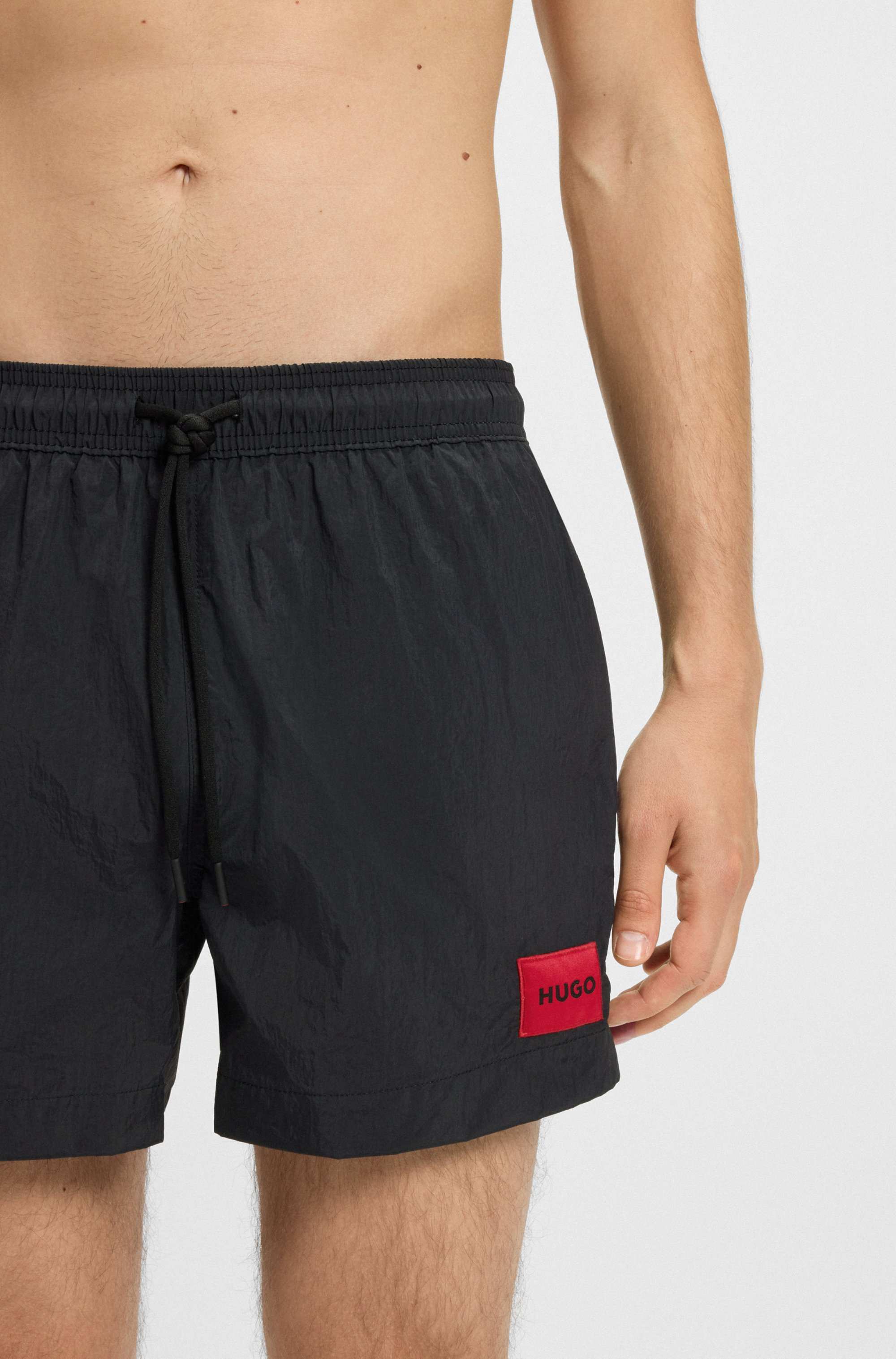 Swim shorts with logo label