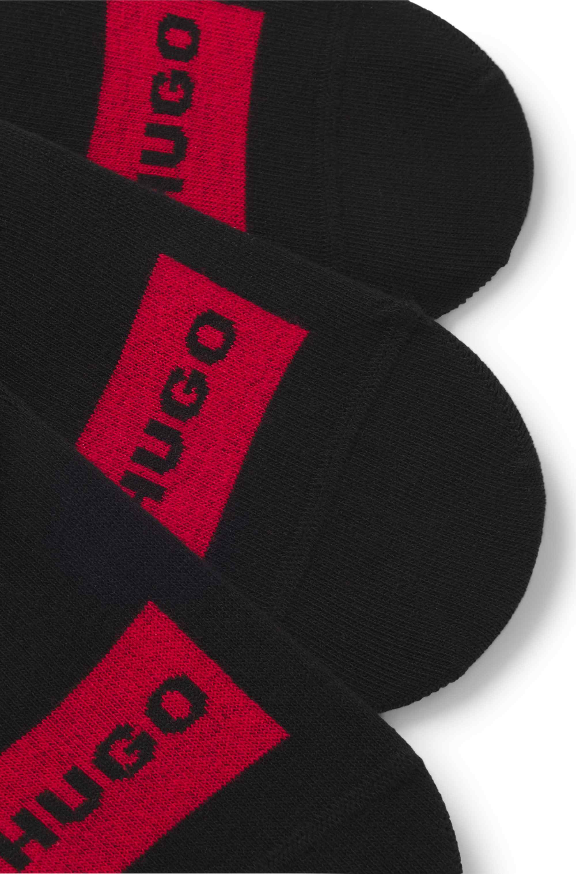 Three-pack of invisible socks with red logo labels