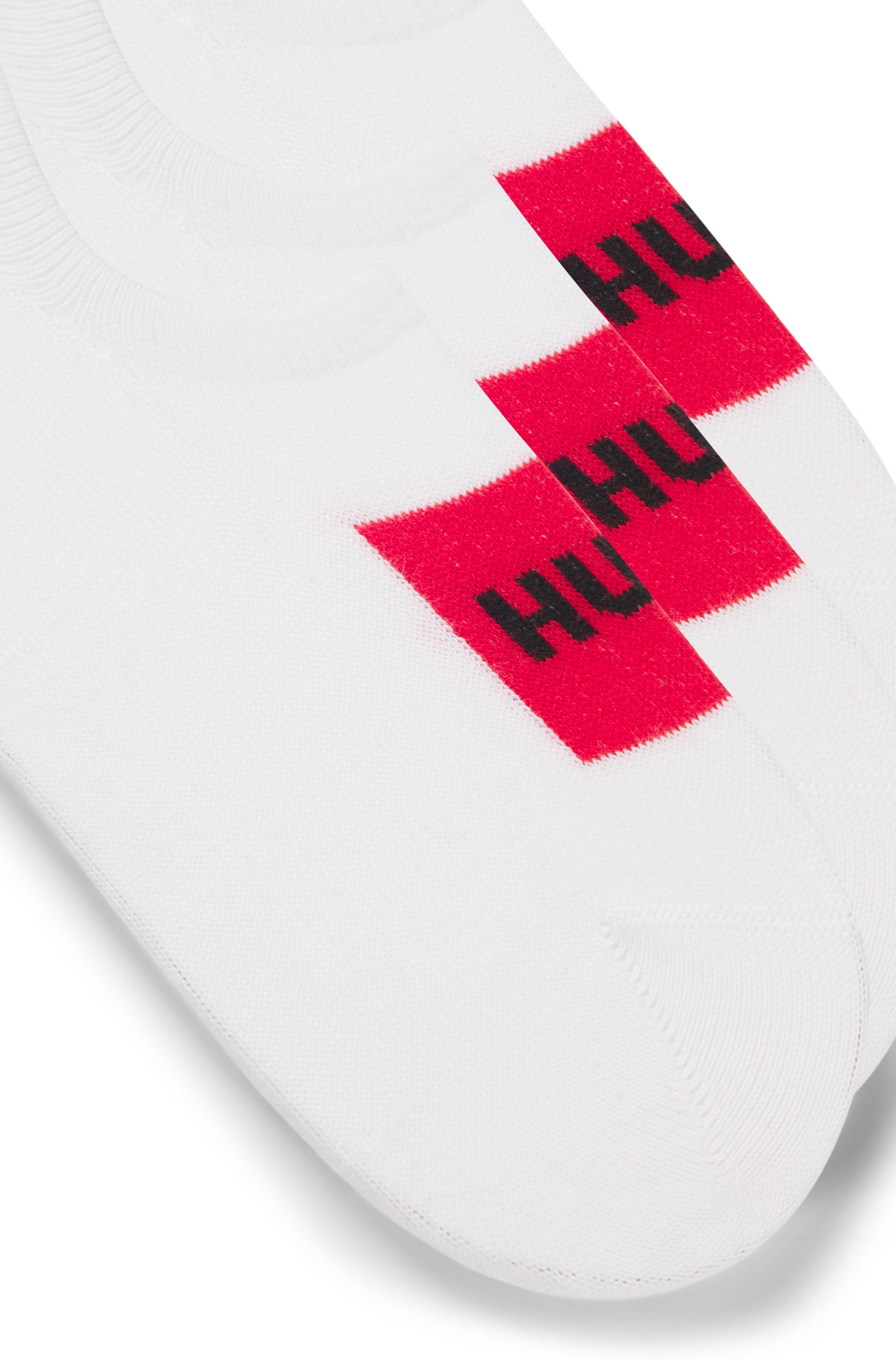 Three-pack of invisible socks with red logo labels