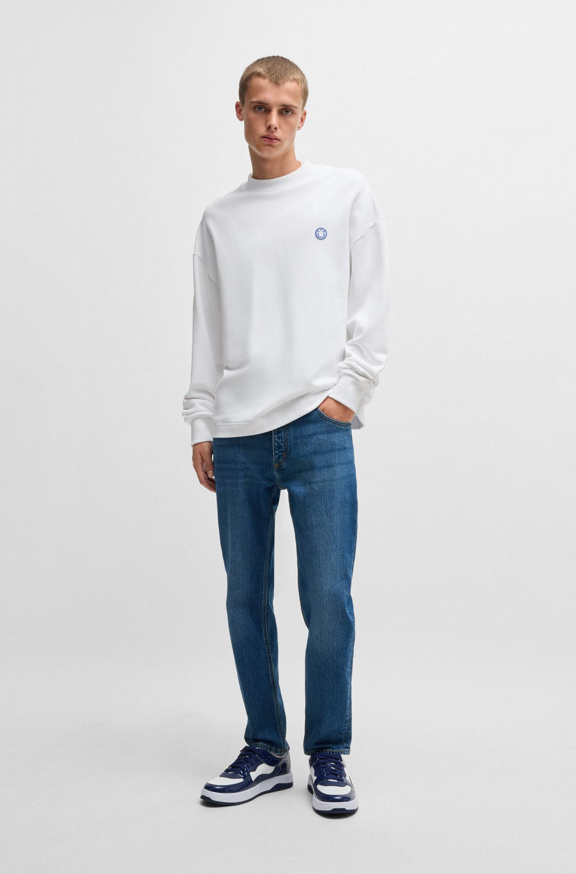 Tapered-fit jeans in mid-blue stretch denim