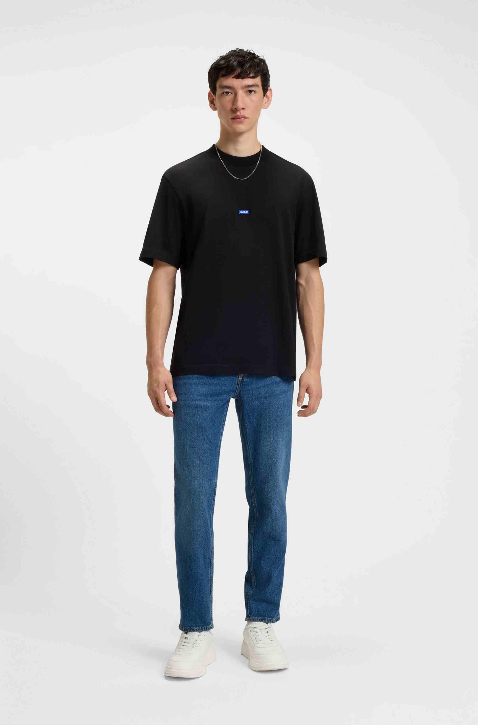 Tapered-fit jeans in mid-blue stretch denim