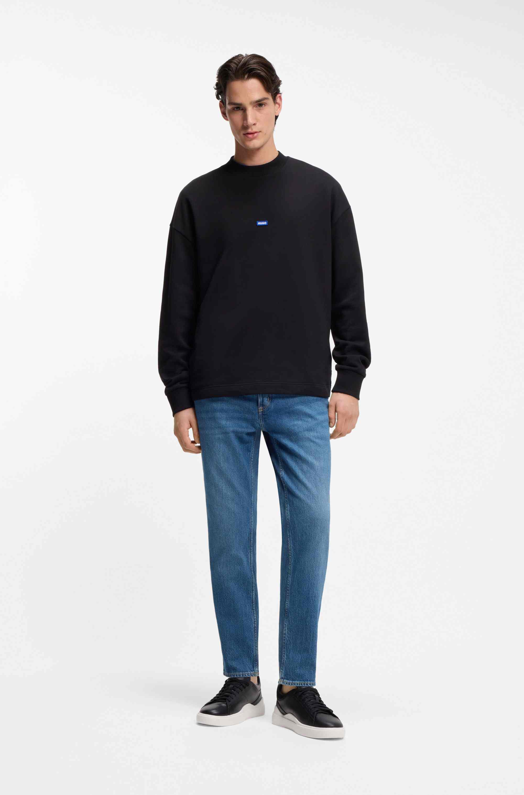 Tapered-fit jeans in mid-blue stretch denim