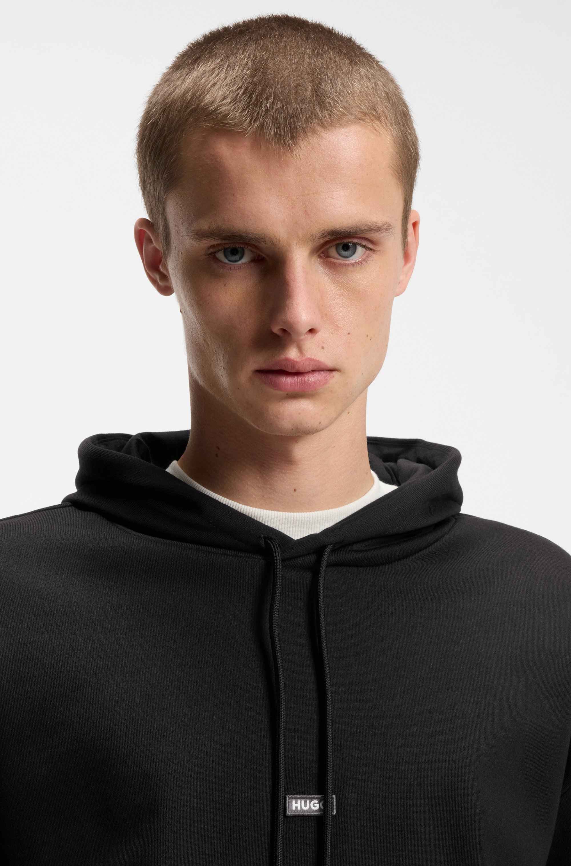 Cotton-terry hoodie with blue logo patch
