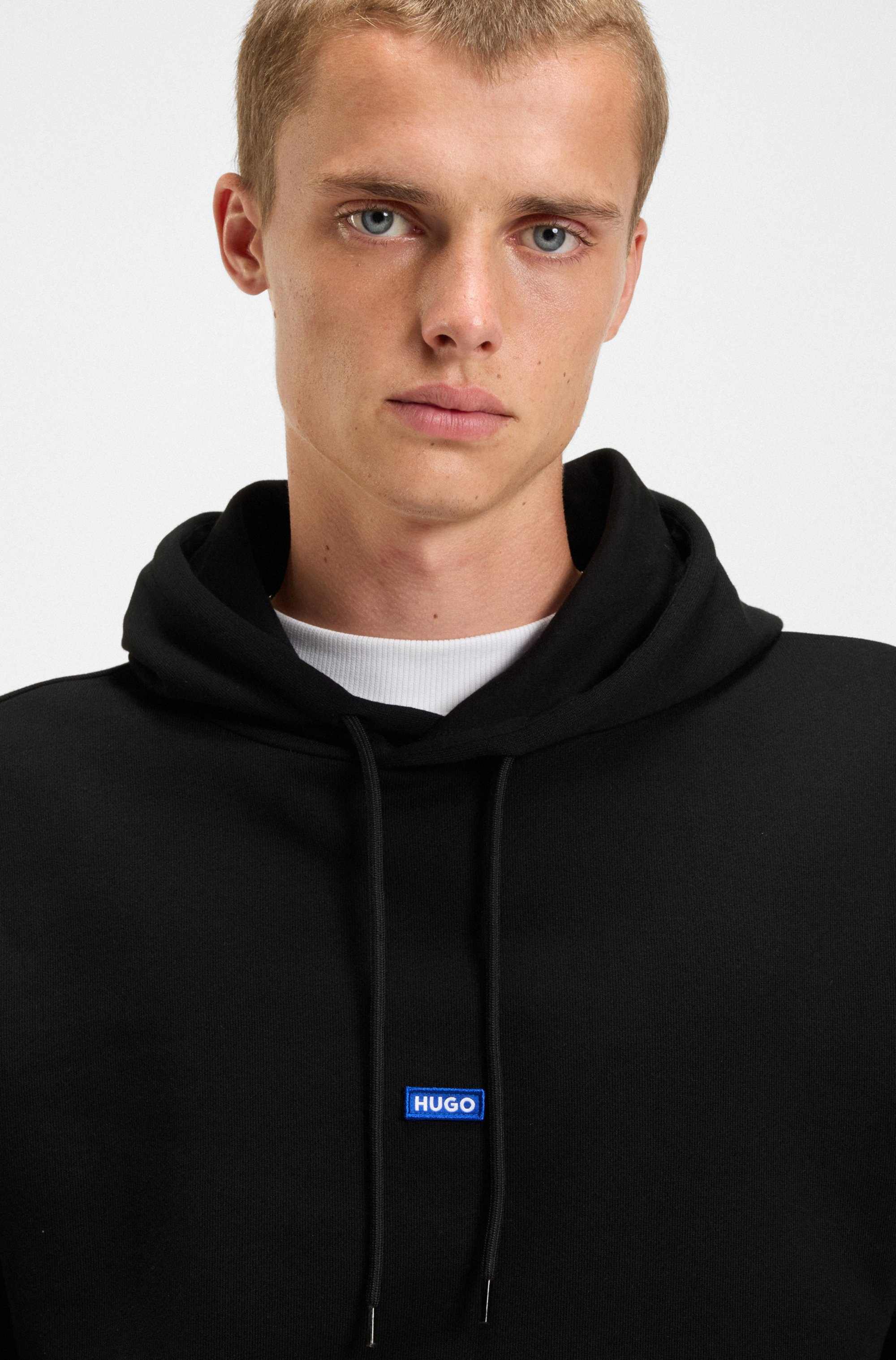 Cotton-terry hoodie with blue logo patch