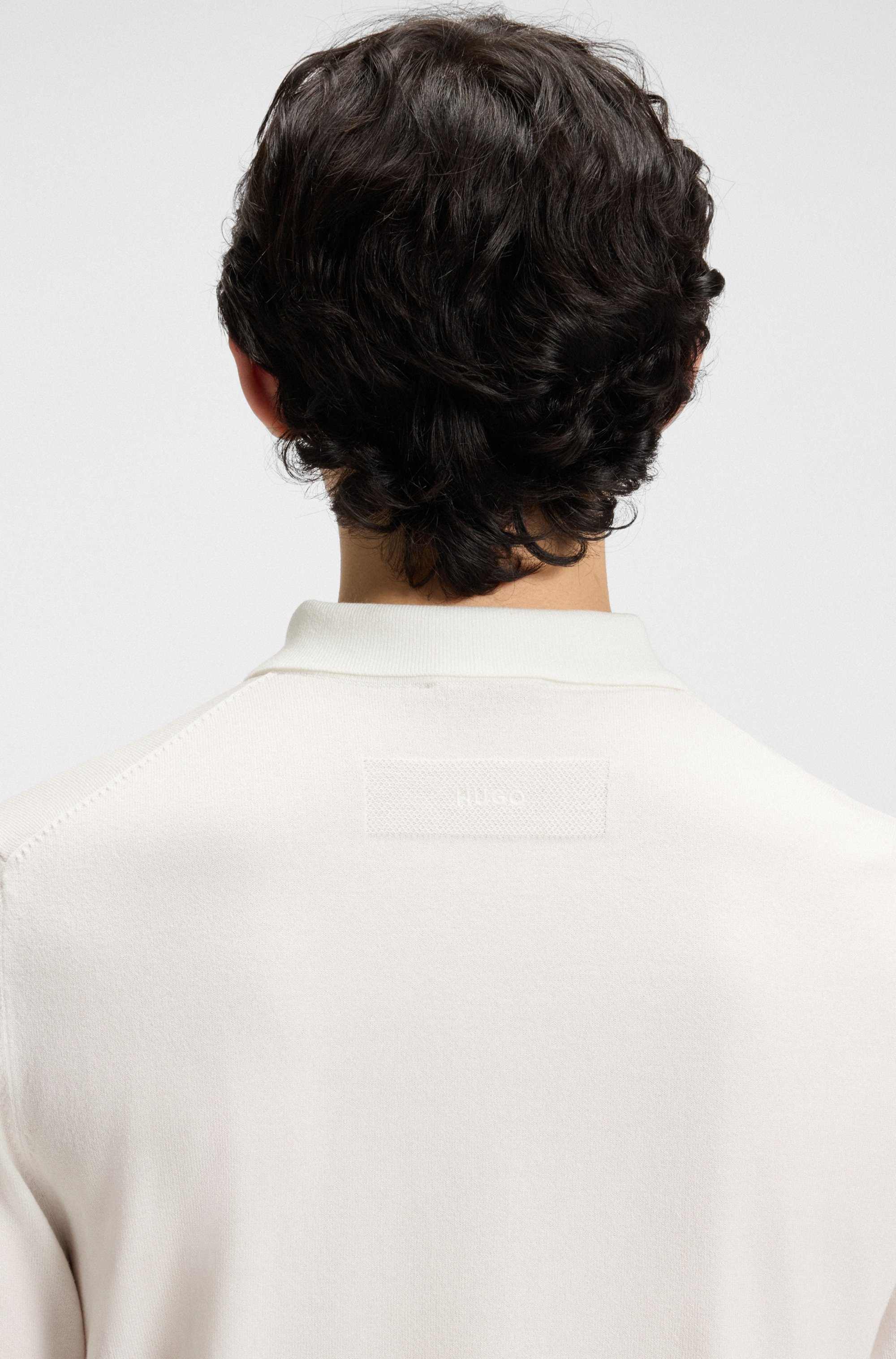 Knit polo with covered placket