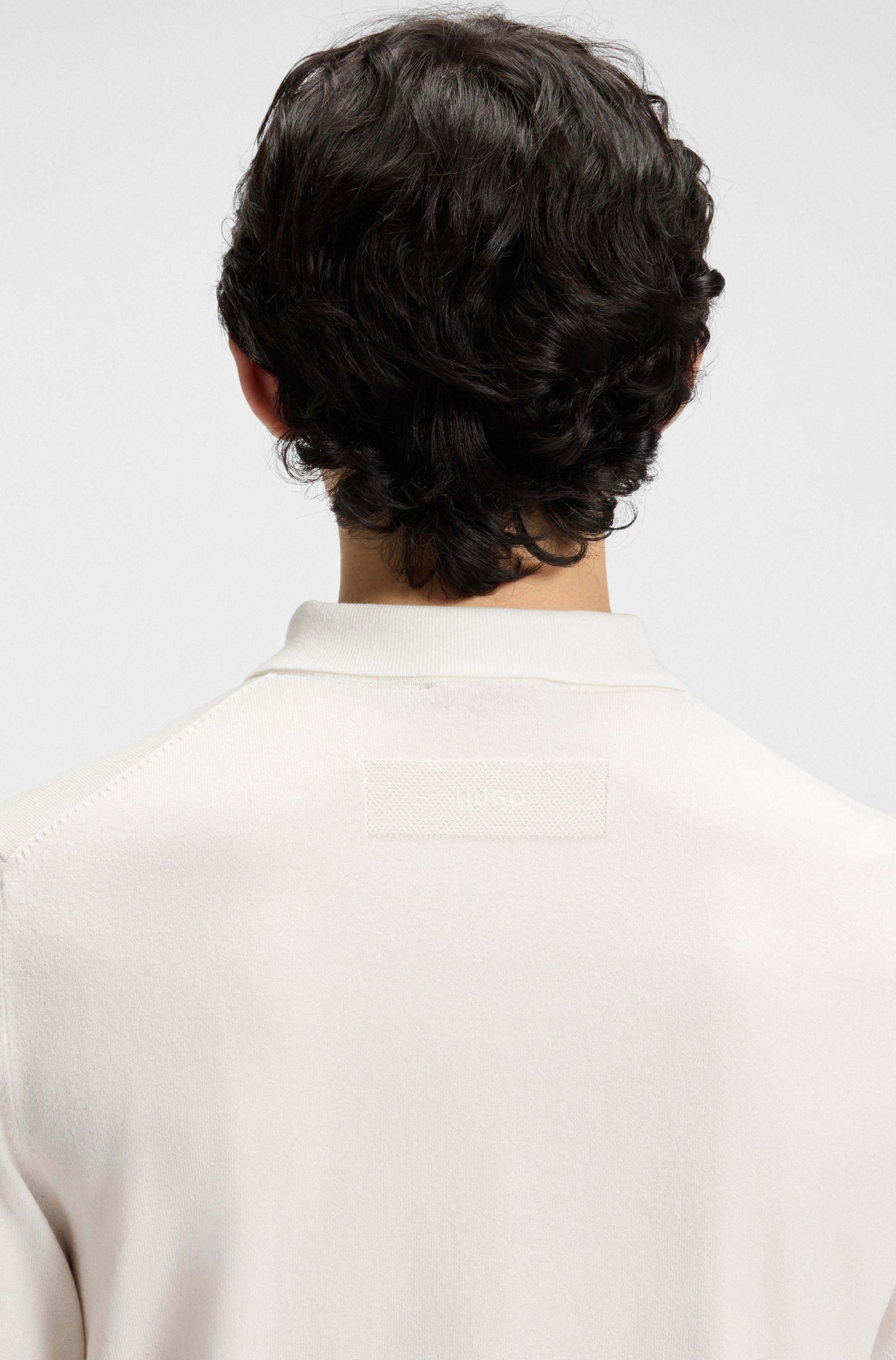 Knit polo with covered placket