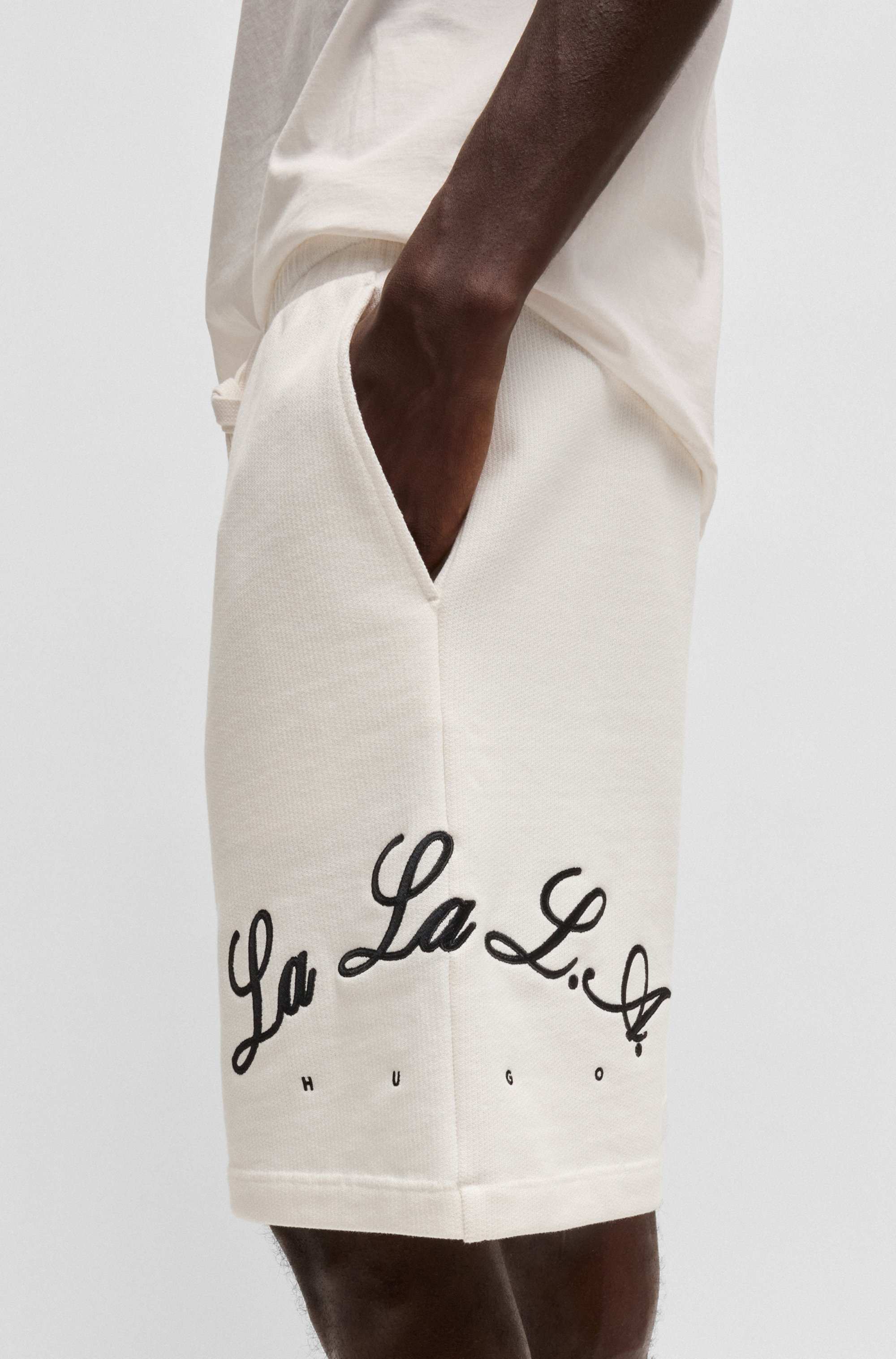 Cotton-terry shorts with logo artwork