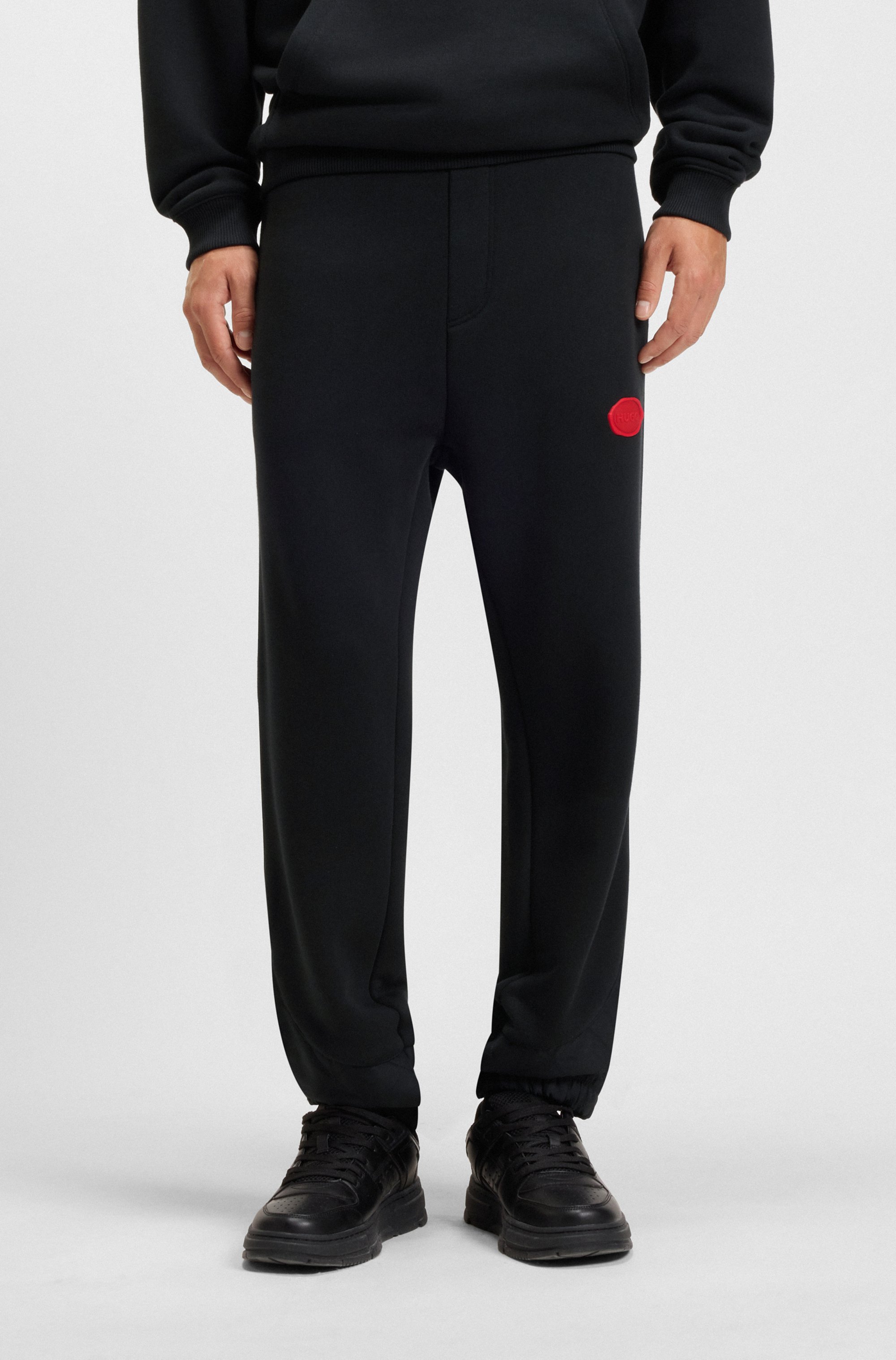 Cotton-blend tracksuit bottoms with waxed-stamp logo