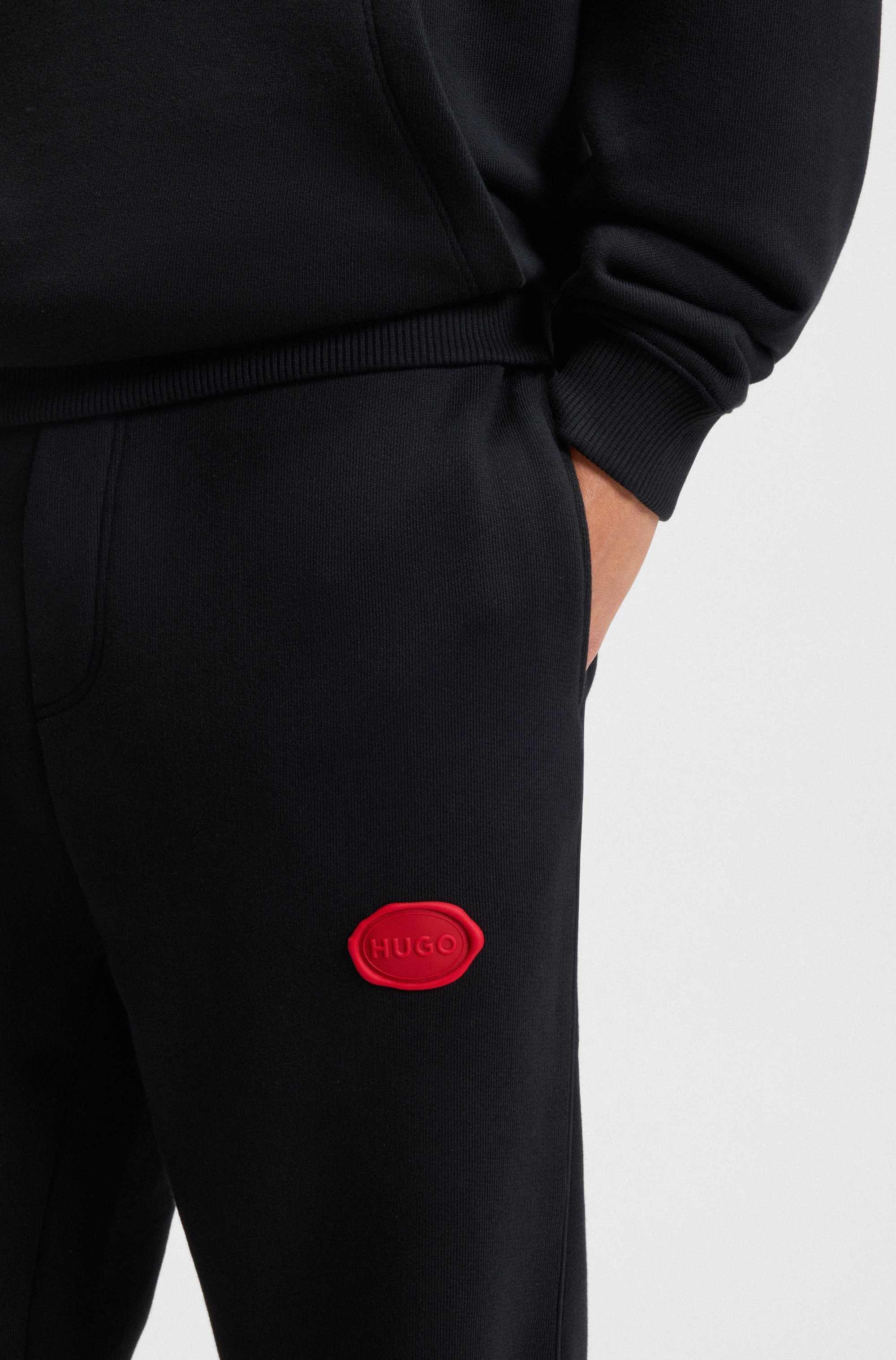 Cotton-blend tracksuit bottoms with waxed-stamp logo