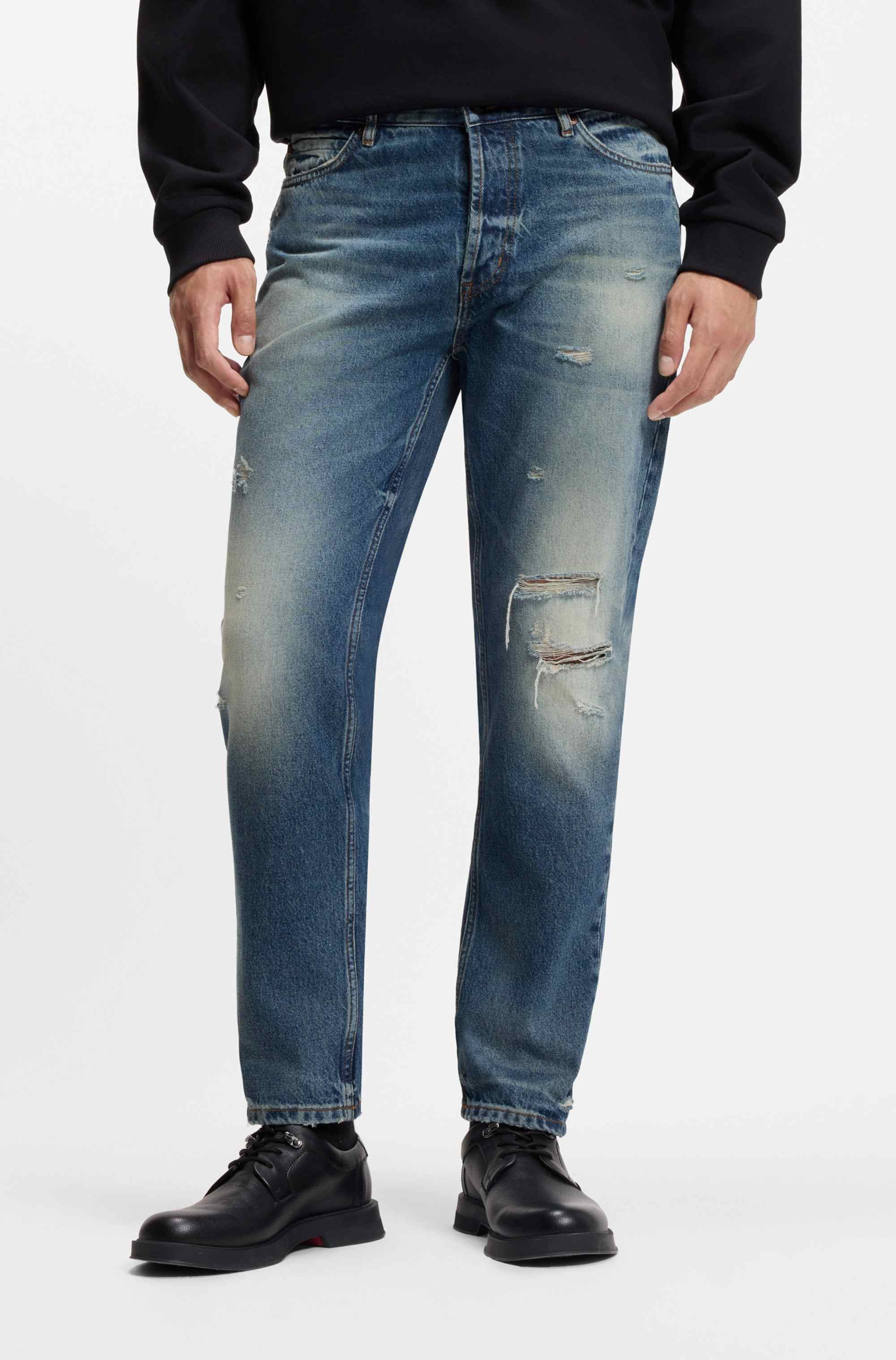 Tapered-fit jeans in distressed blue denim