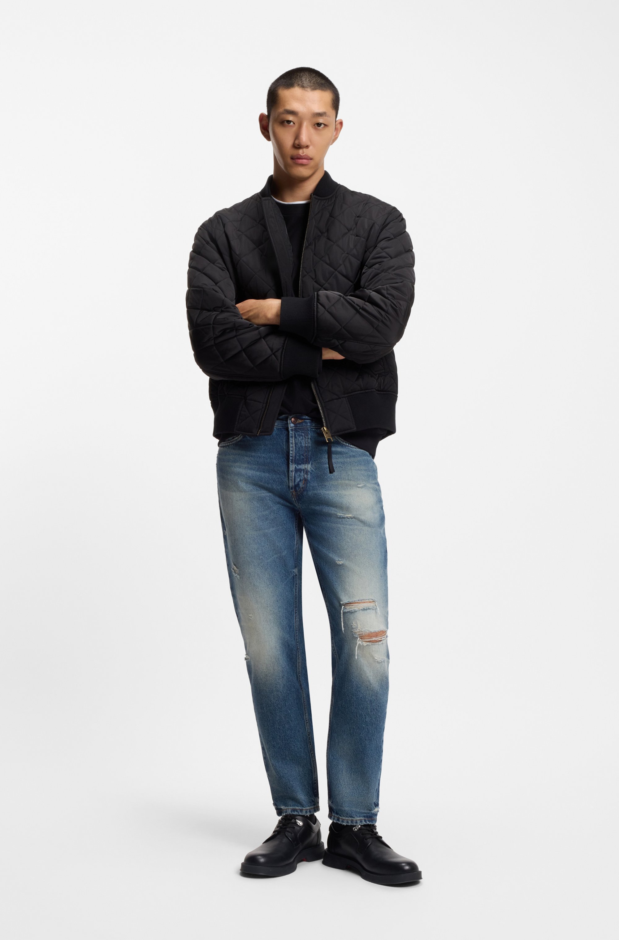 Tapered-fit jeans in distressed blue denim