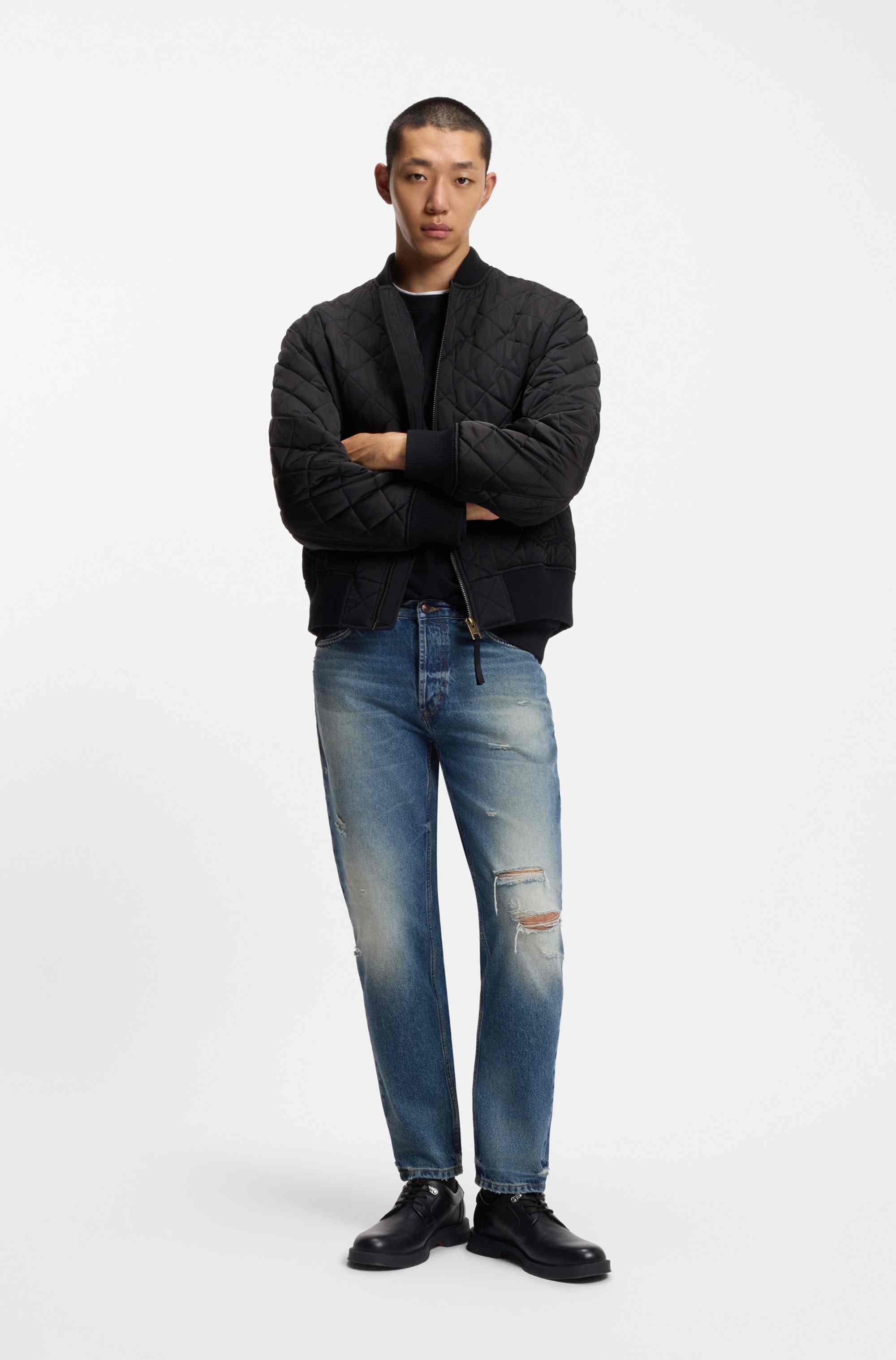 Tapered-fit jeans in distressed blue denim