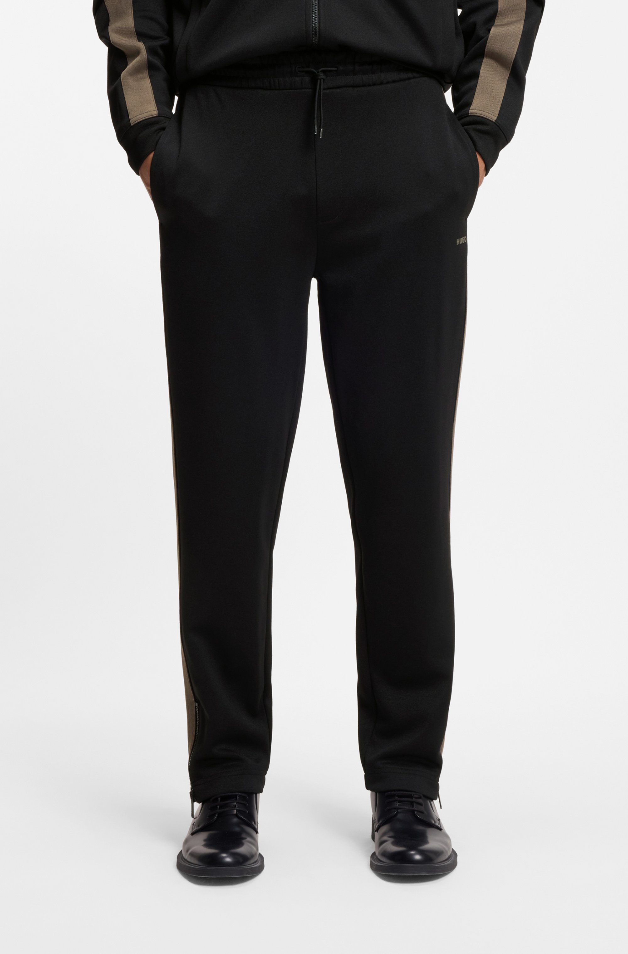 Relaxed-fit tracksuit bottoms with logo tape