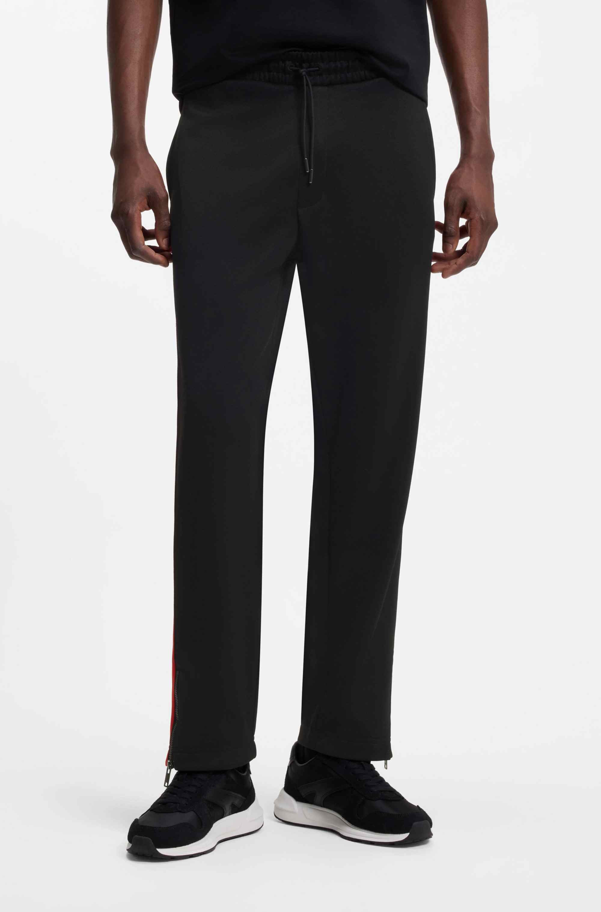 Relaxed-fit tracksuit bottoms with logo tape