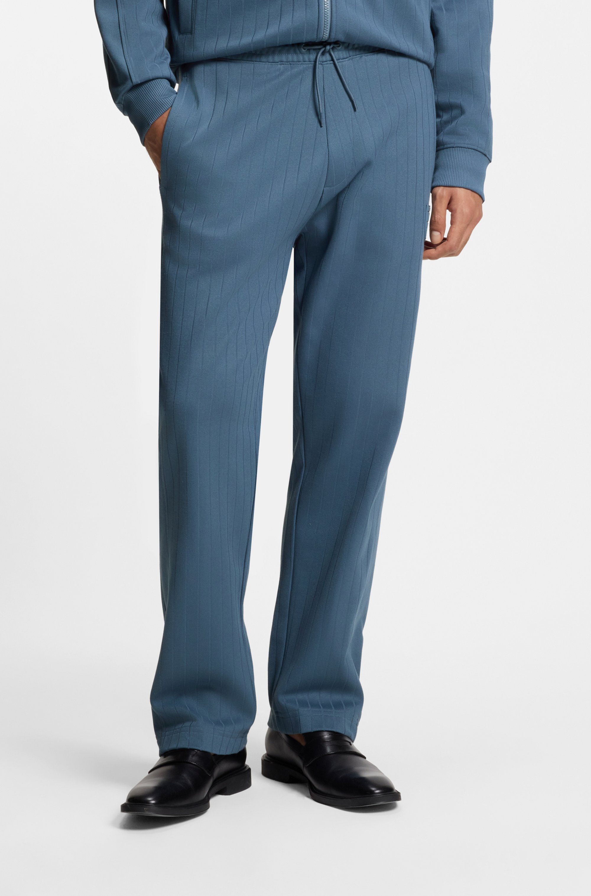 Cotton-blend tracksuit bottoms with drop-needle stripe