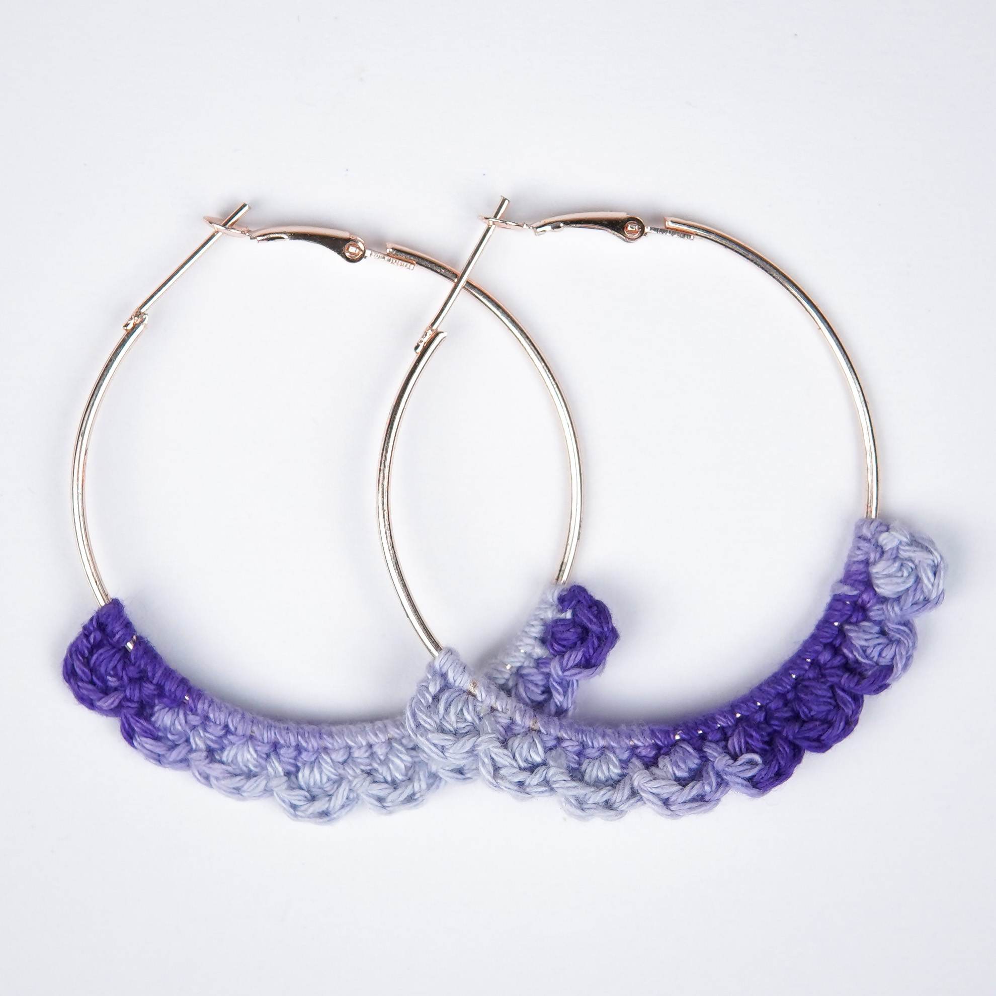 Close-up of AHG's Dual-Shade Lavender Crochet Nazakat Hoops. Delicate crochet in a beautiful blend of lavender!