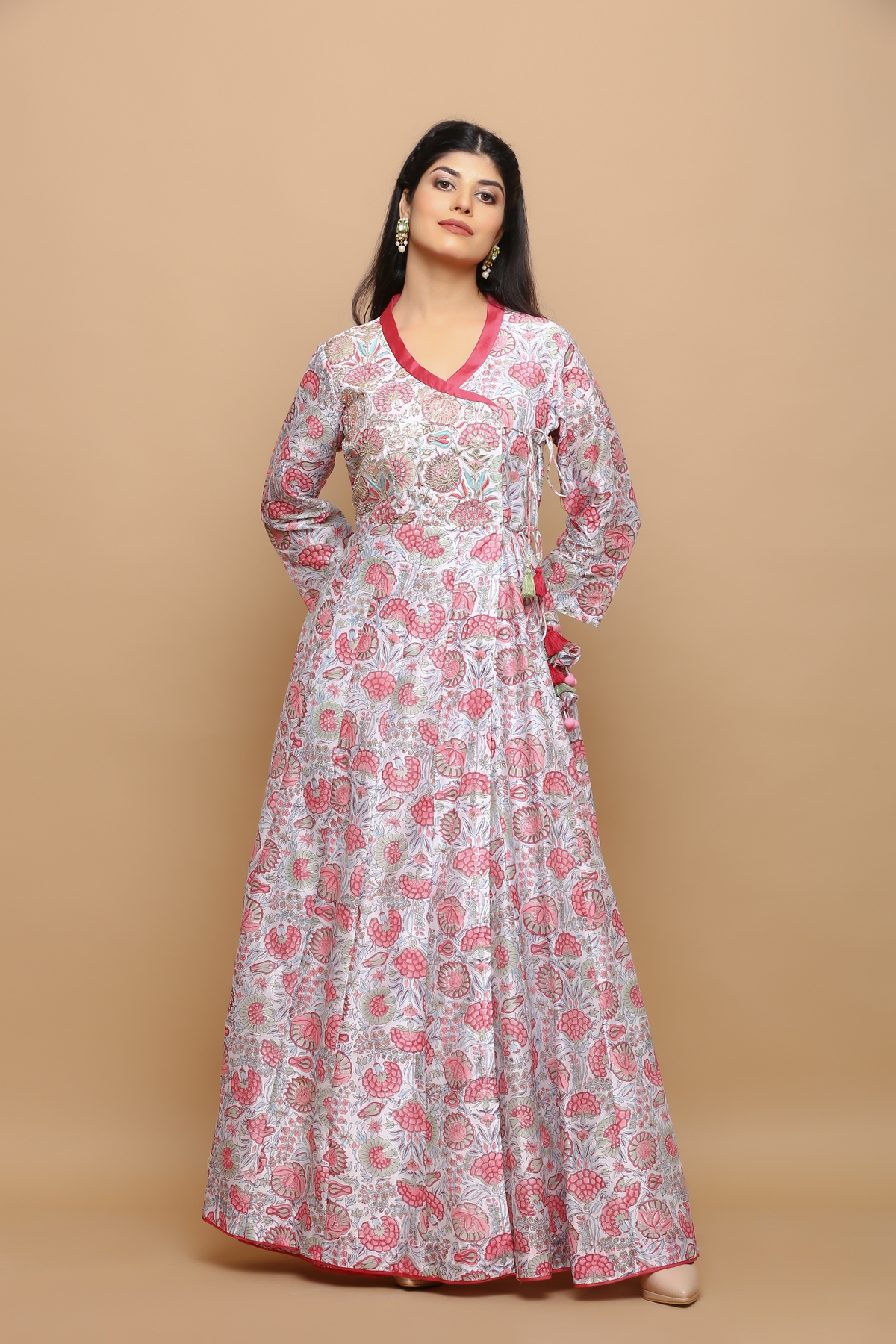 White block printed jaal chanderi angrakha anarkali kurta with handwork on the yoke and tassels on the side and is fully lined .