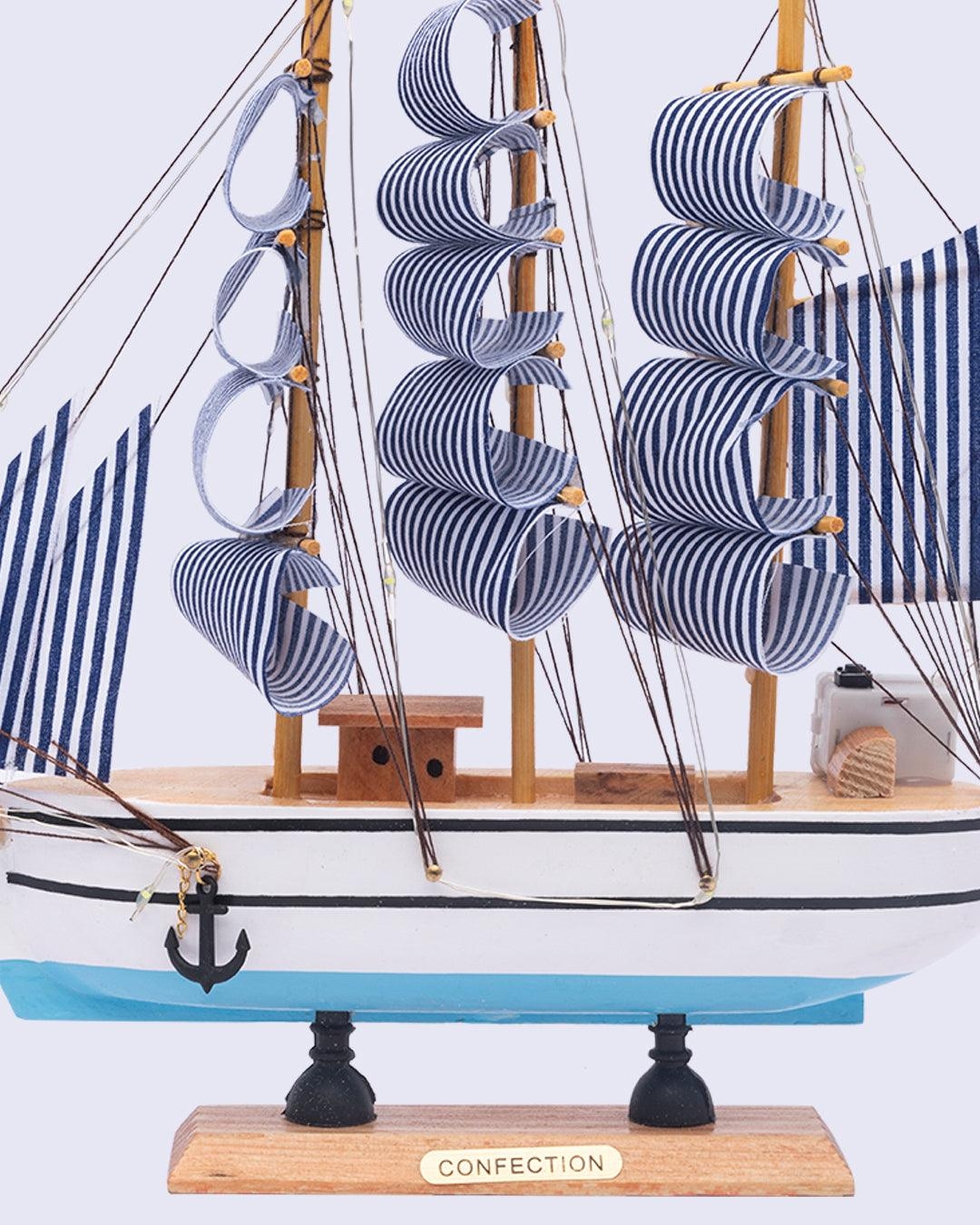 Wooden handmade boat ship model on blue background — Stock Photo