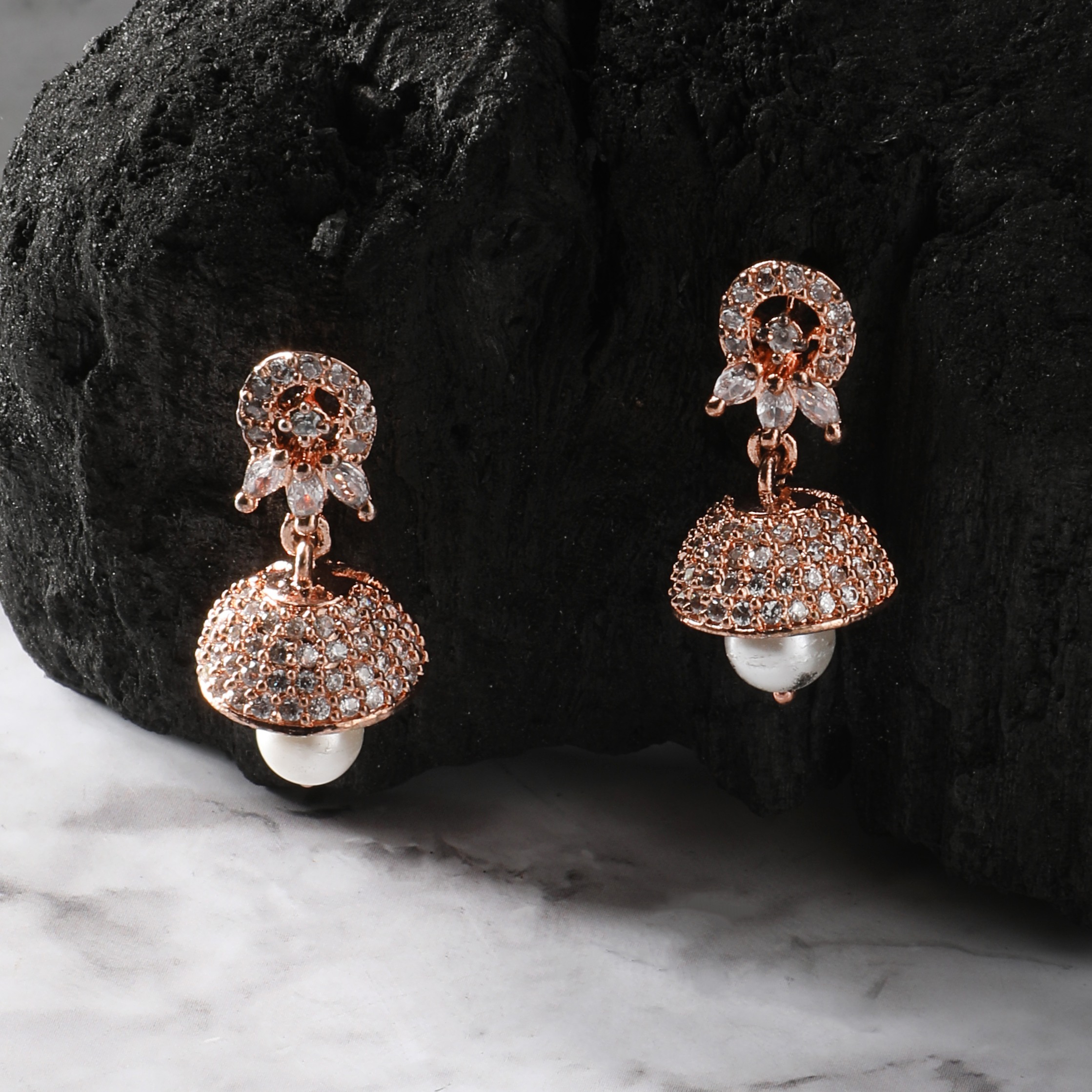 The Nila Rose Gold White Stone Crystal Studded Jhumkas