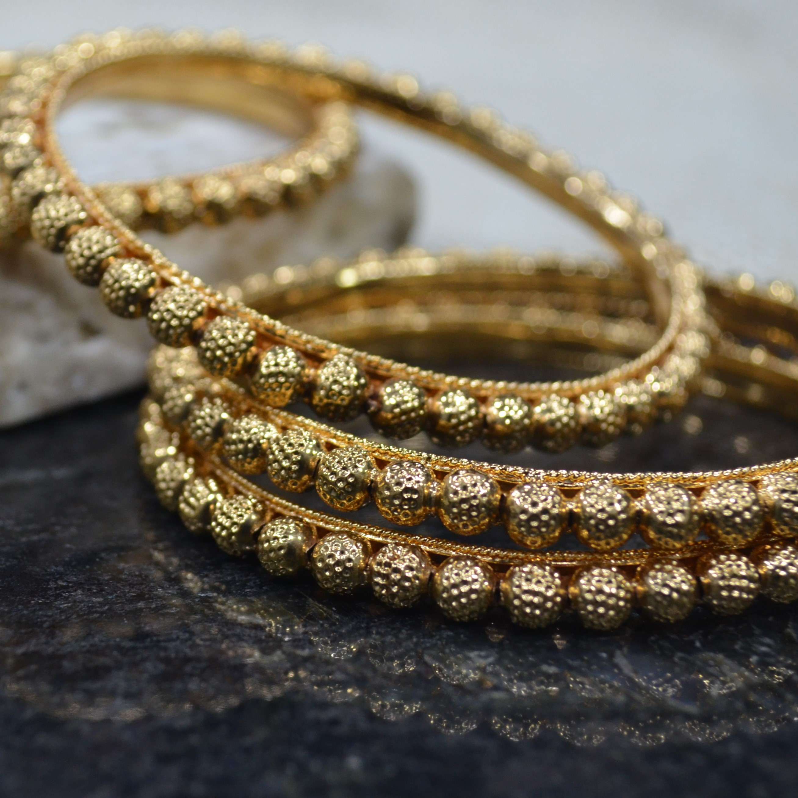The Nila Gold Plated Beaded Temple Design Bangle Set
