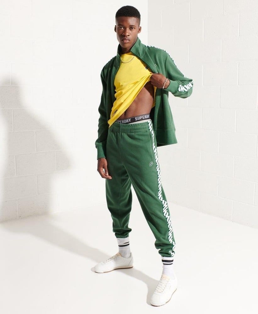 Green tape logo track pants shop