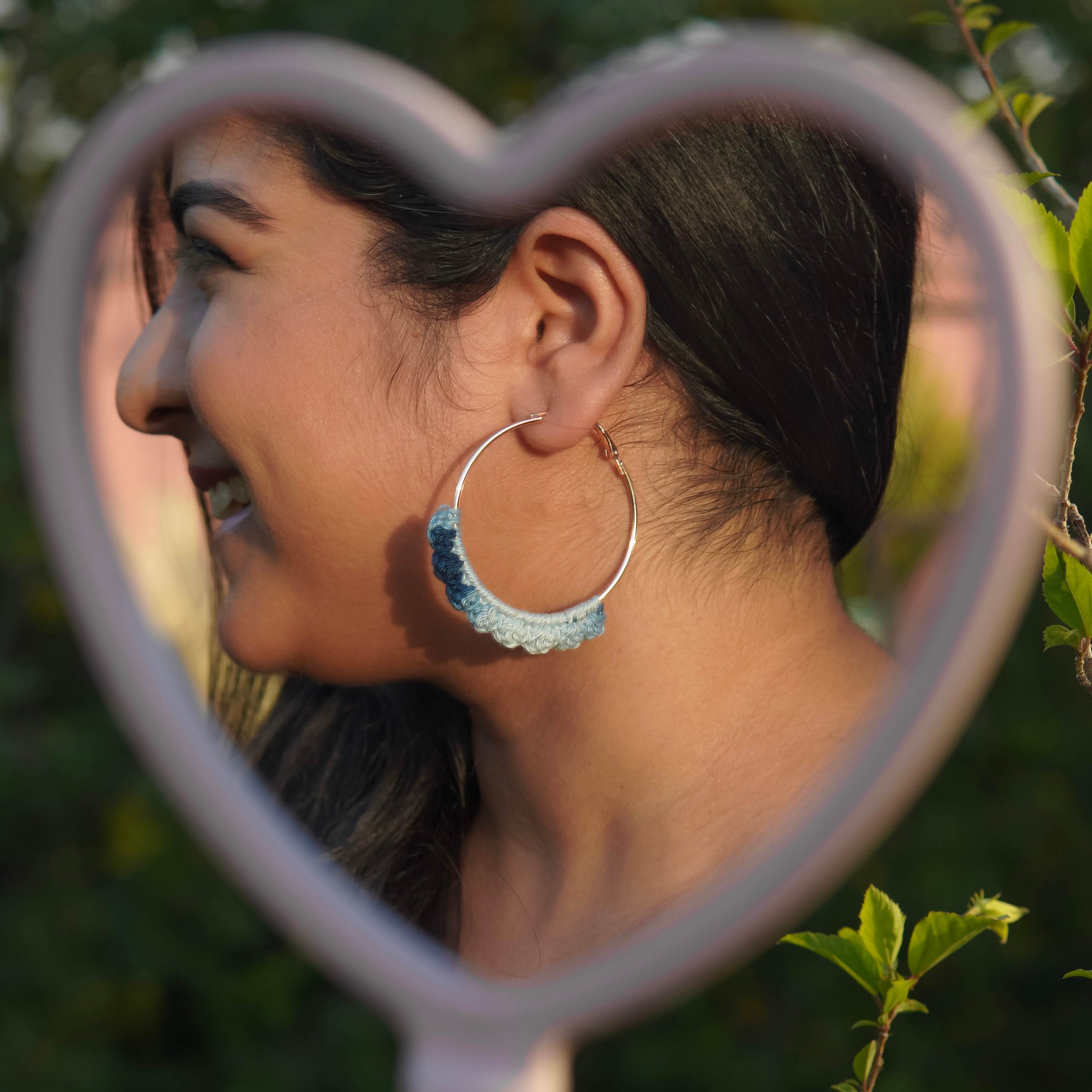 Model wearing the Denim Blue Crochet Nazakat Hoops by AHG. Perfect for everyday style!
