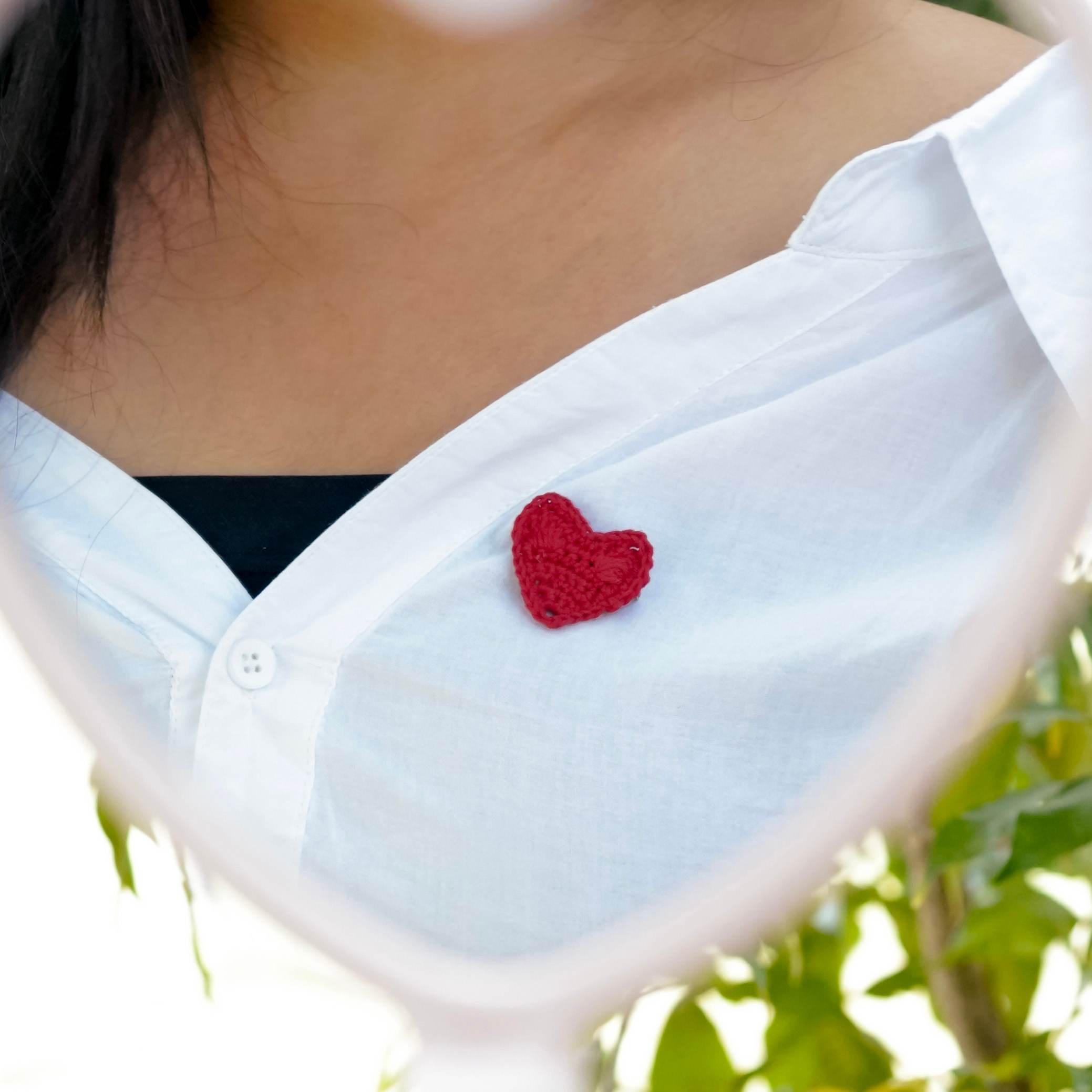 Model showcasing the Red Heart Brooch by A Handcrafted Gaatha styled, highlighting versatility.