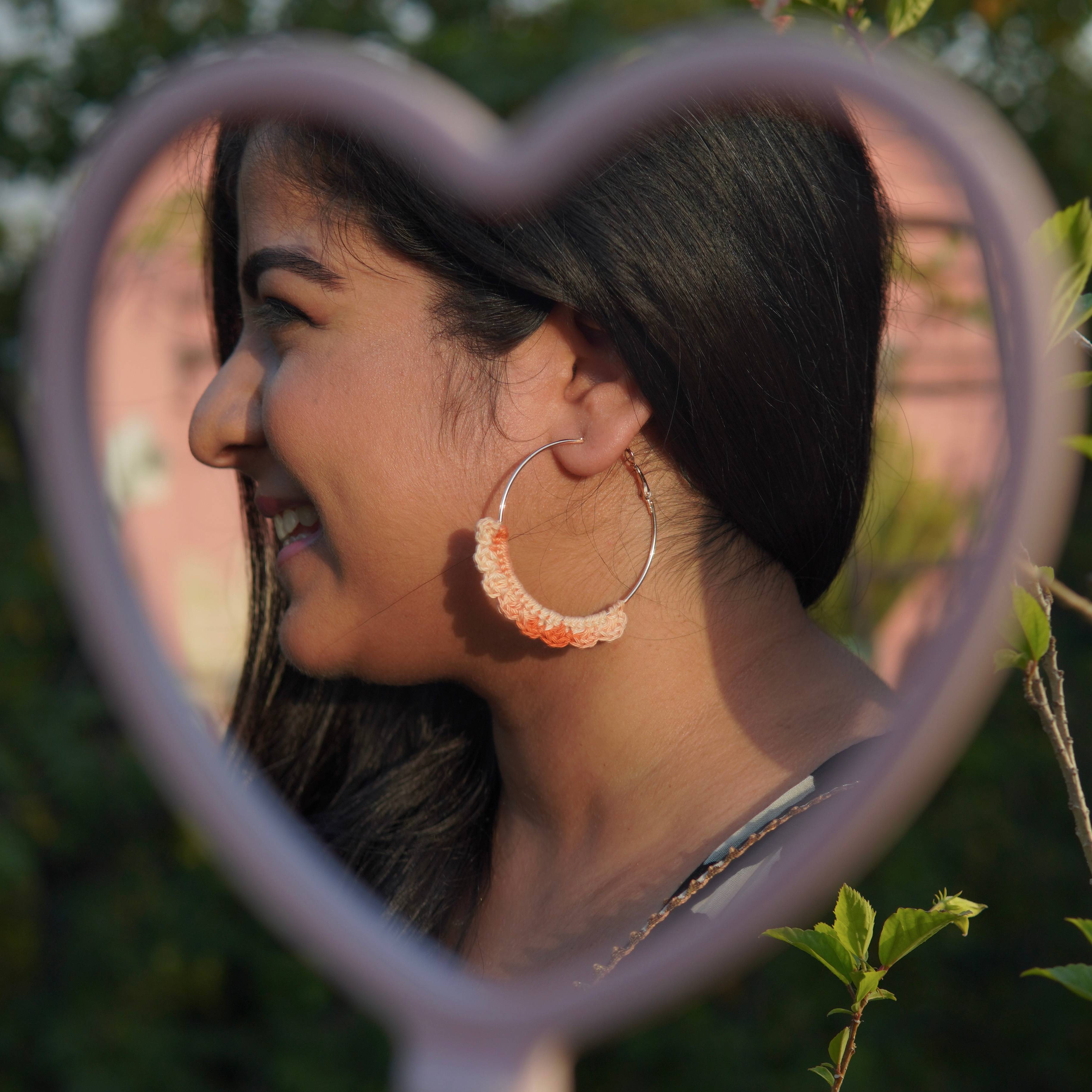 Model wearing the Dual-Shade Peach Crochet Nazakat Hoops by AHG. Perfect for everyday style!