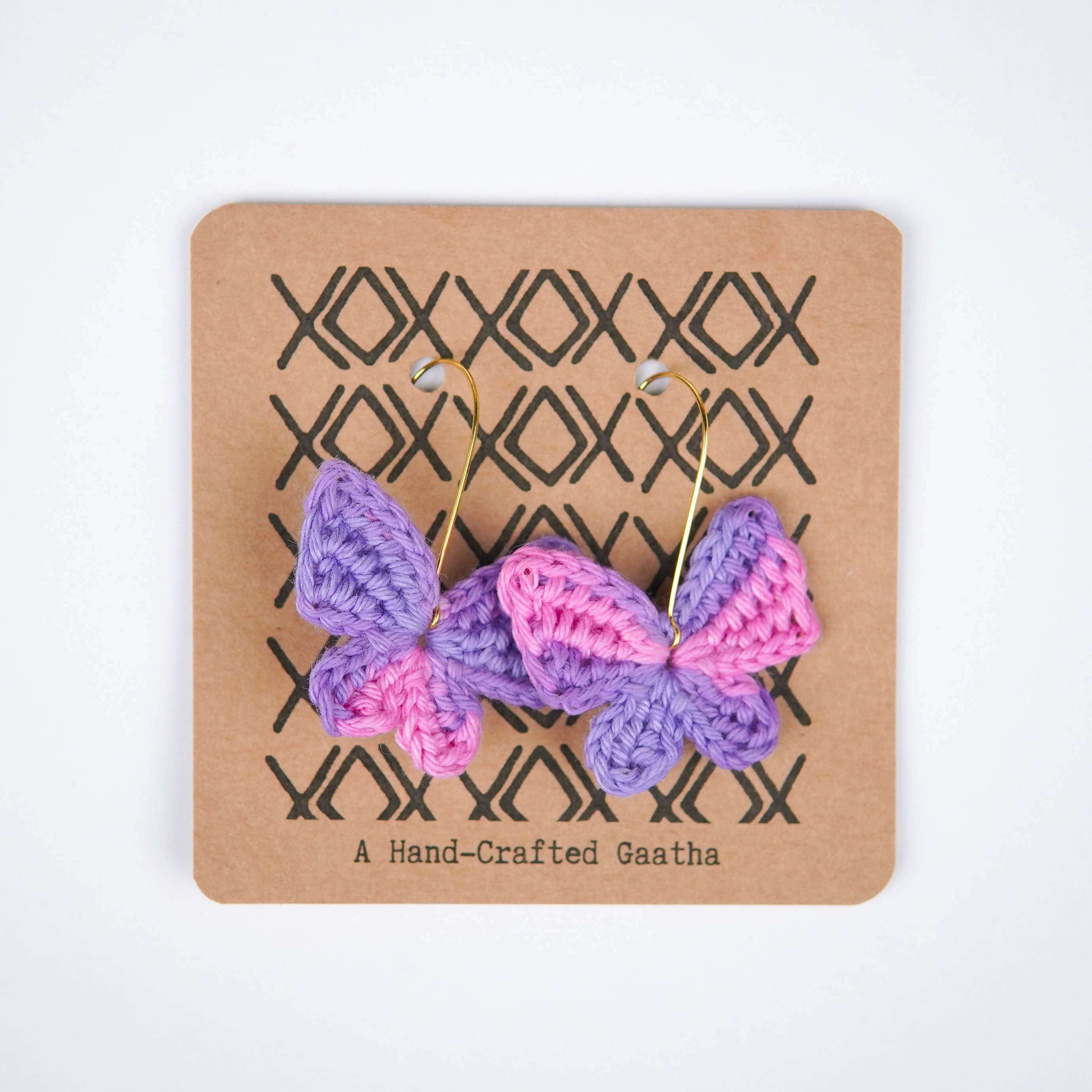 Close-up of the intricate crochet details and the beautiful pink & purple hues of the titli earrings.