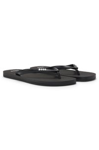 Flip-flops with branded strap