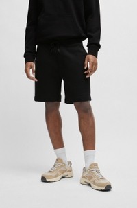 Relaxed-fit shorts in cotton terry with logo badge