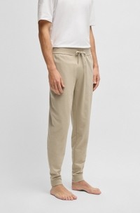 Drawcord tracksuit bottoms in cotton terry with logo print