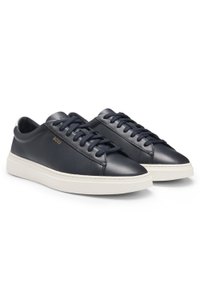Lace-up trainers in polished leather with logo details