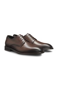 Italian-made Derby shoes in leather with ornamental stitching