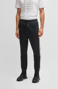 Relaxed-fit tracksuit bottoms with jacquard-woven circles