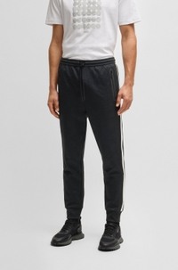 Relaxed-fit tracksuit bottoms with jacquard-woven circles