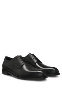 Derby shoes in printed and smooth leather
