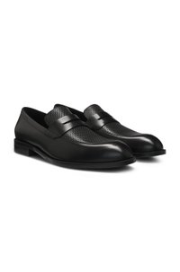 Penny loafers in printed and smooth leather